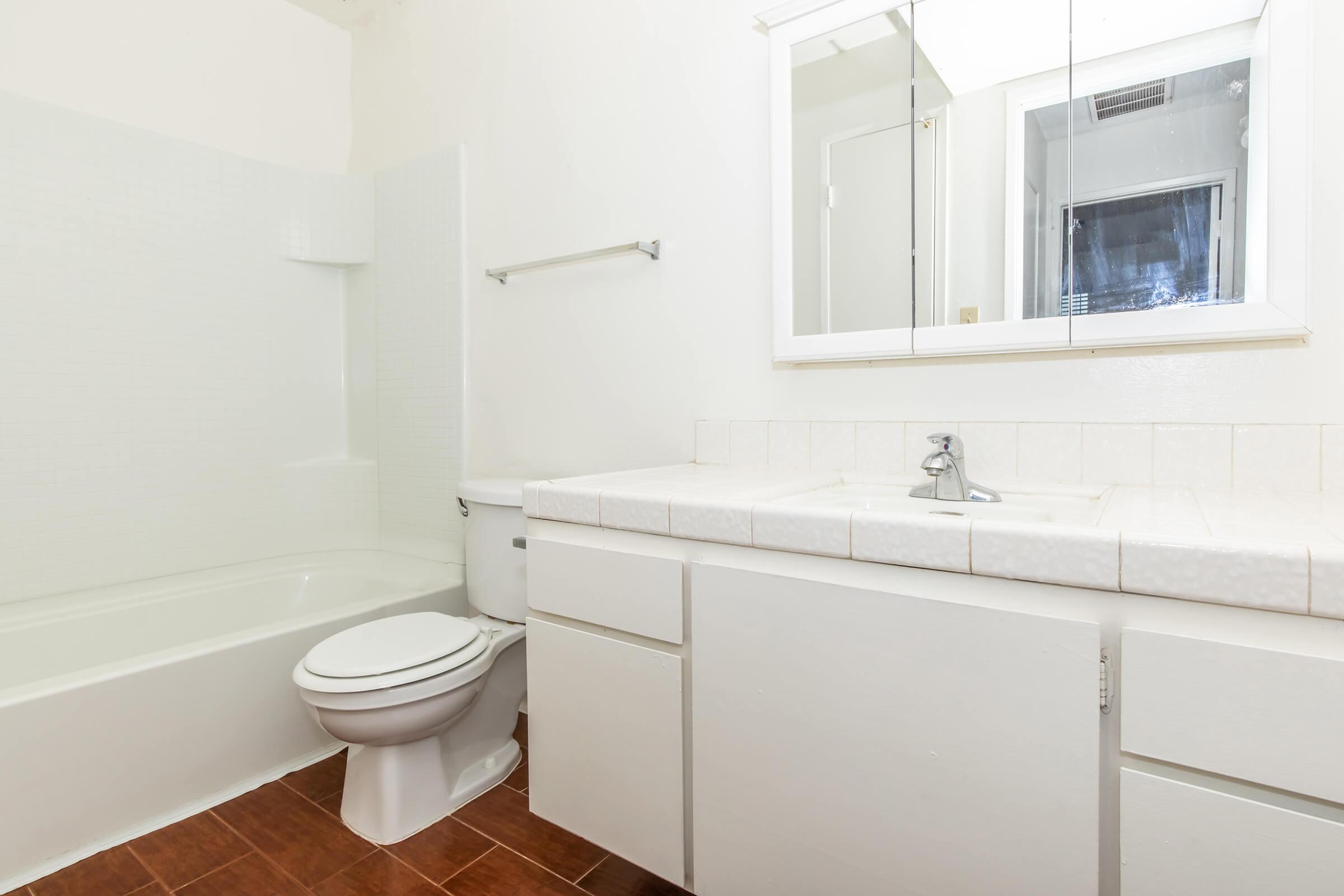 a sink sitting under a window