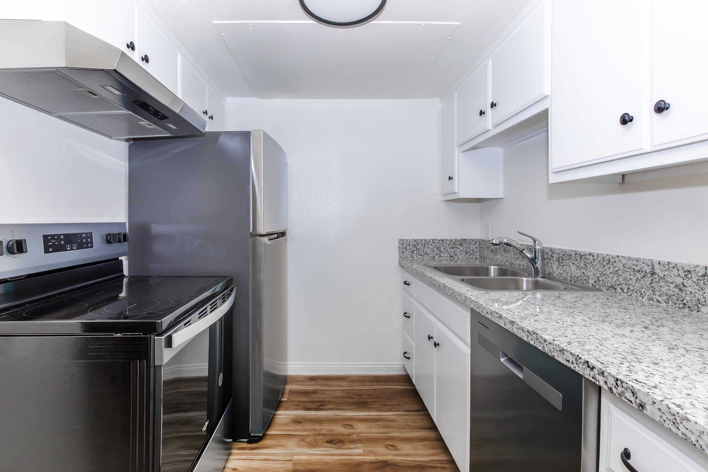 a kitchen with a stove top oven