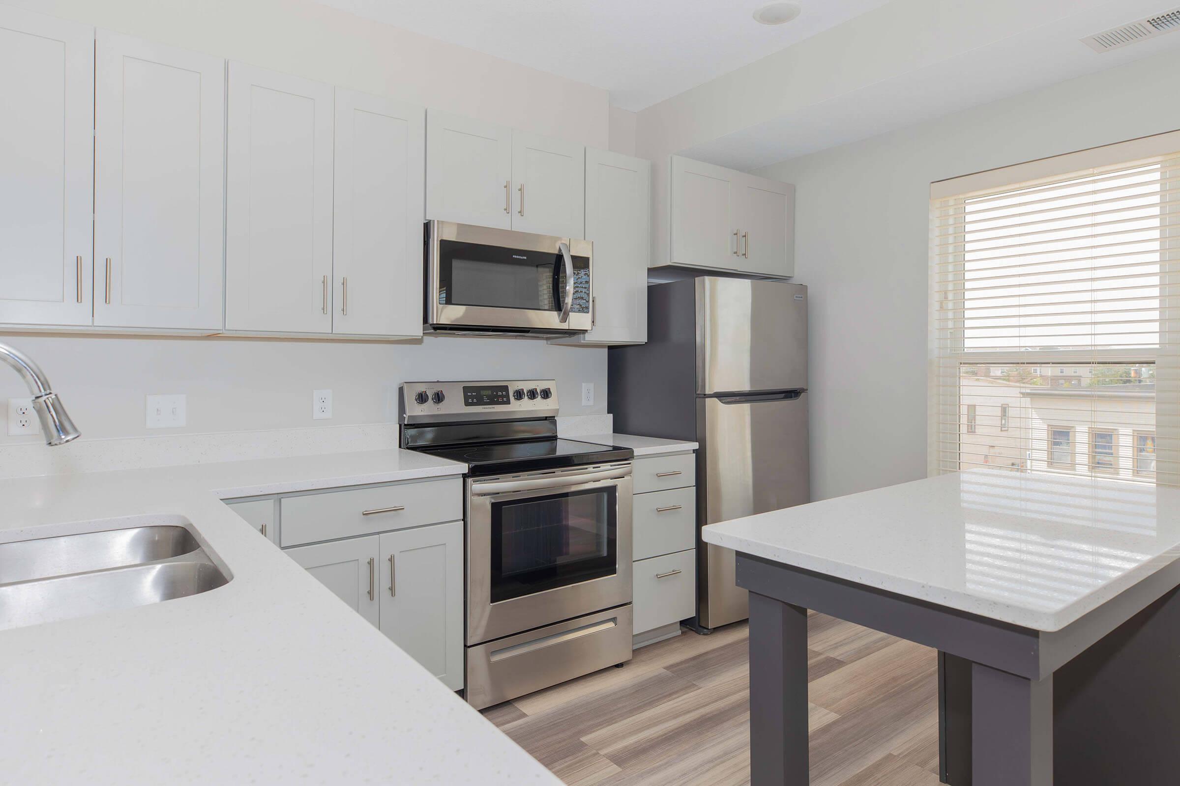 a kitchen with a sink and a microwave