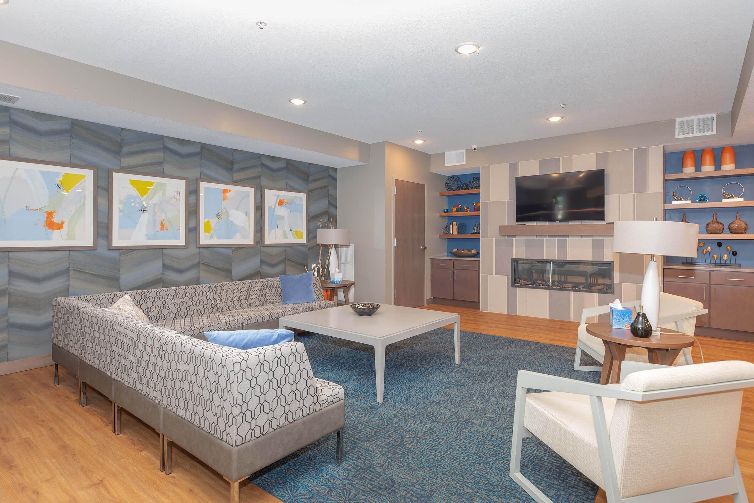 a living room filled with furniture and a table