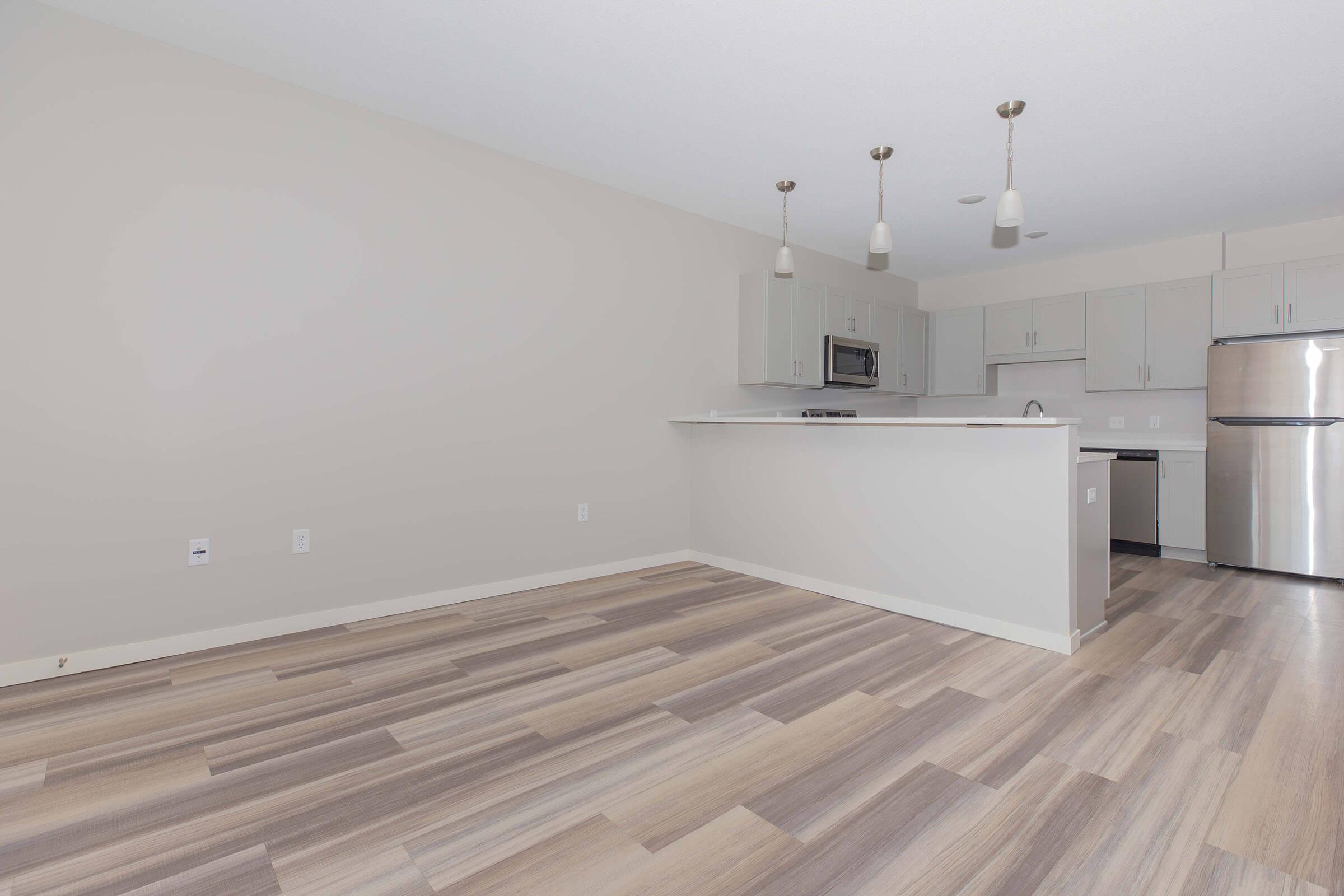 a kitchen with a building in the background