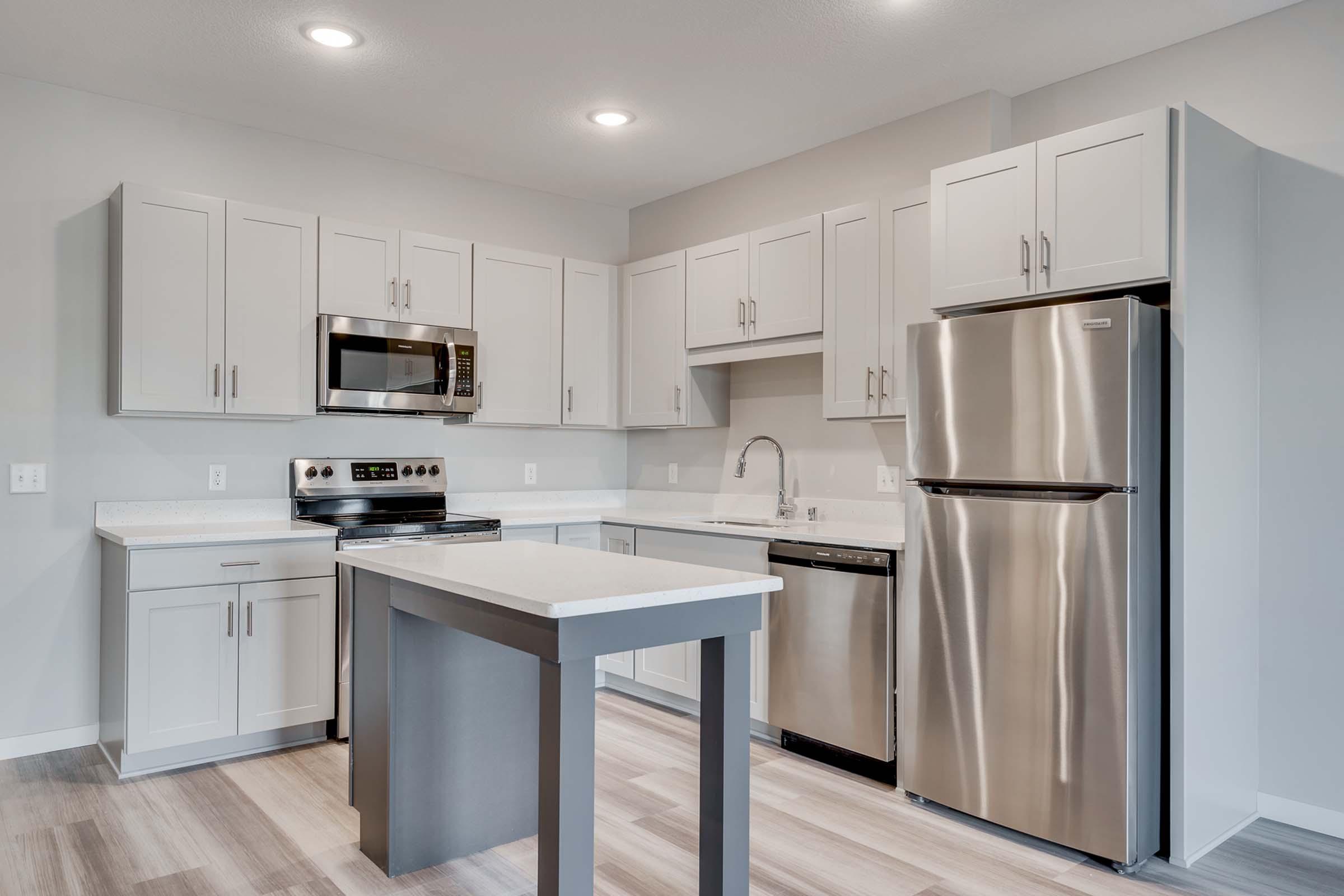 a modern kitchen with stainless steel appliances