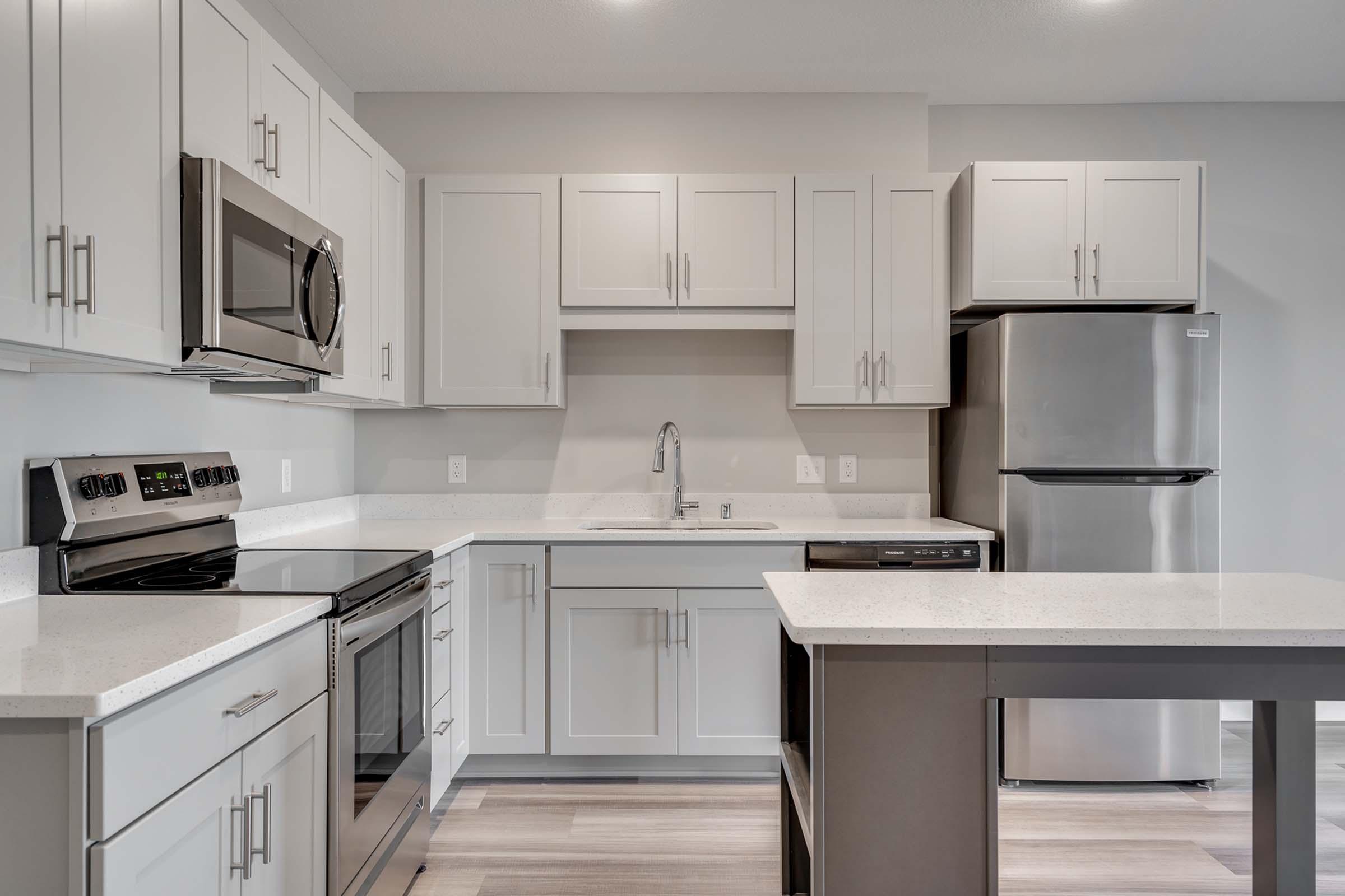 a kitchen with a stove and a microwave