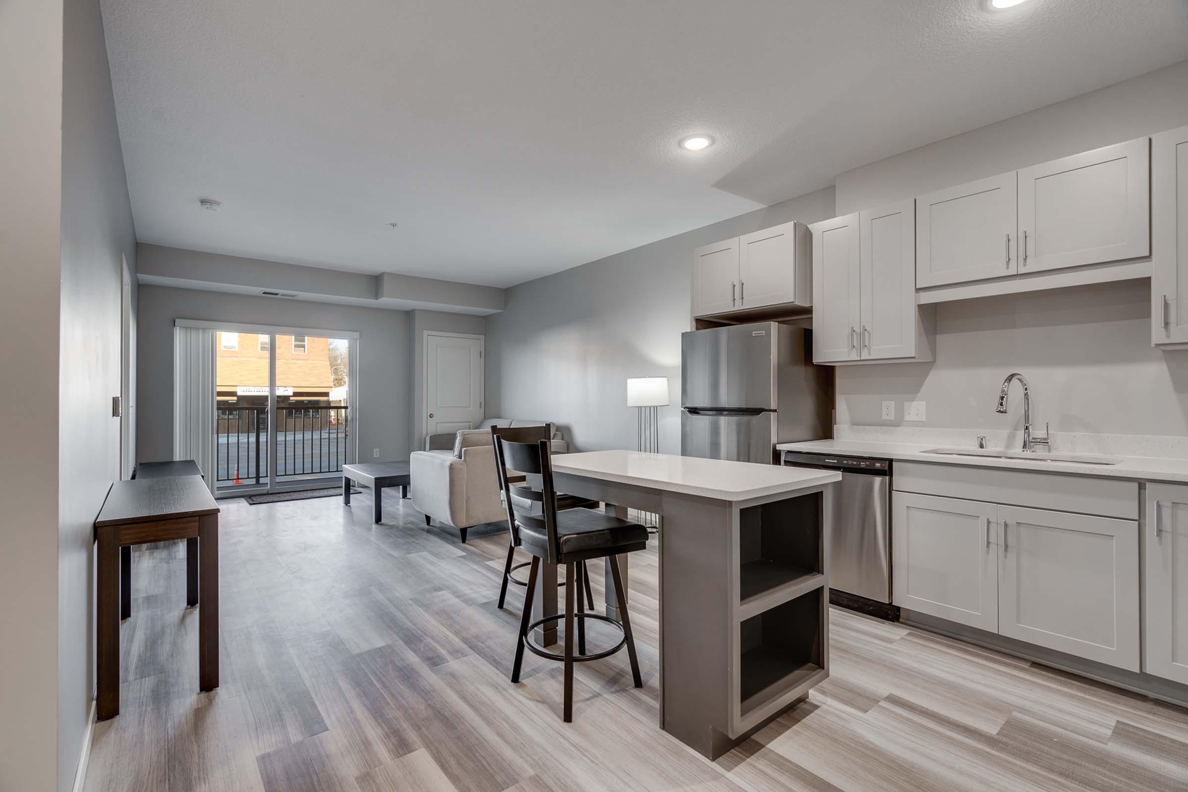 a kitchen with an island in the middle of a room