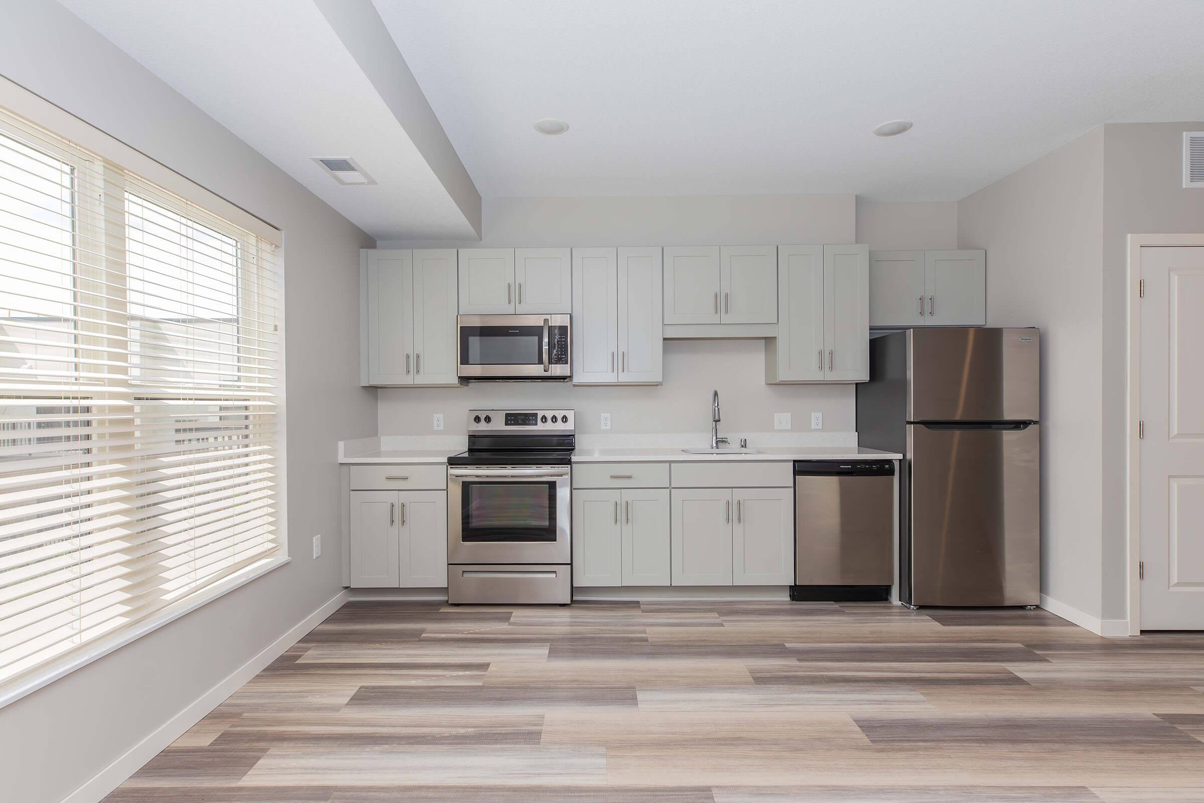 a kitchen with a large window