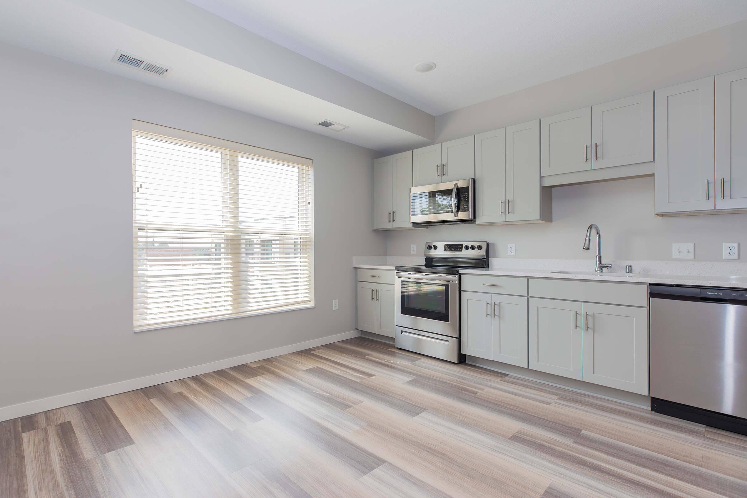 a large kitchen with stainless steel appliances