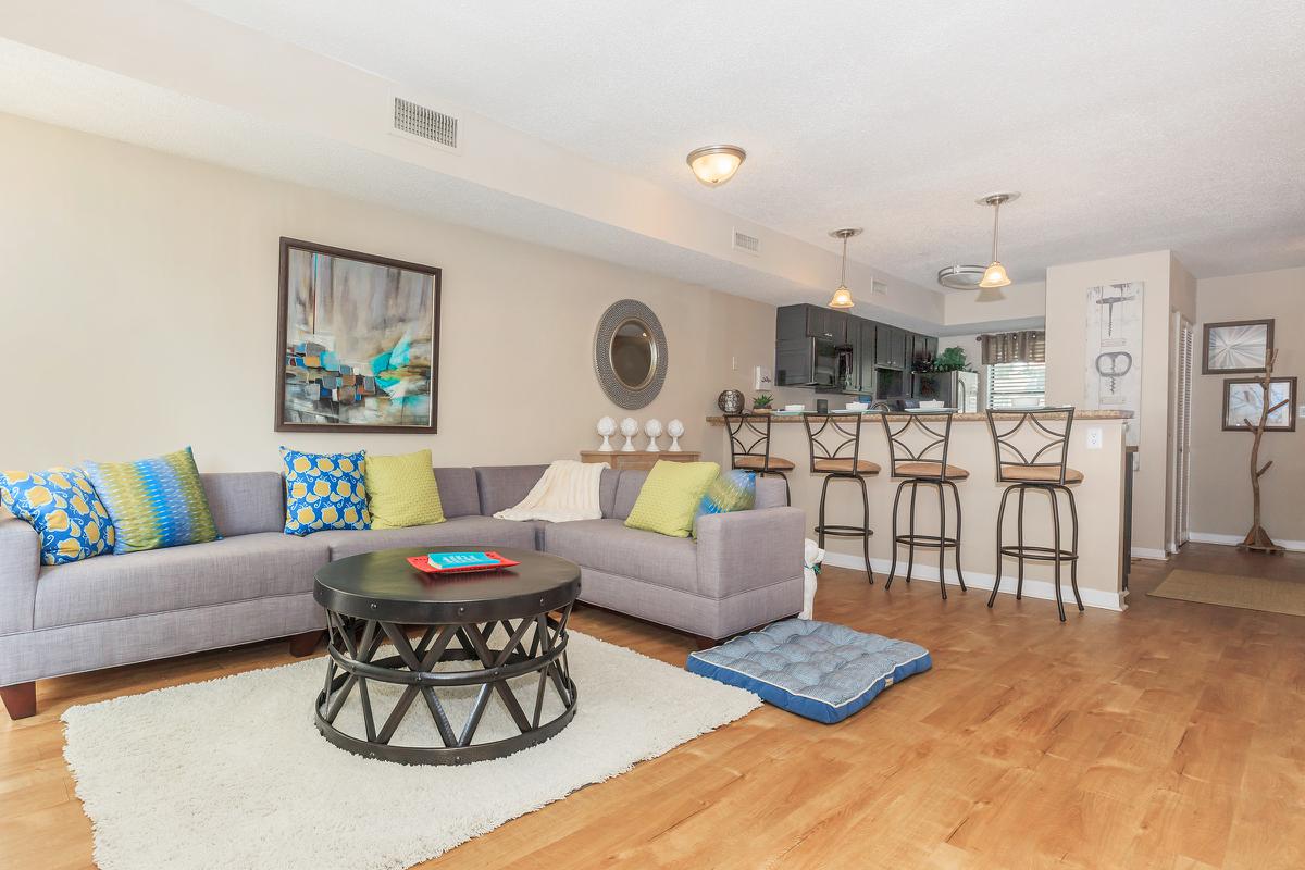 a living room filled with furniture and a fireplace