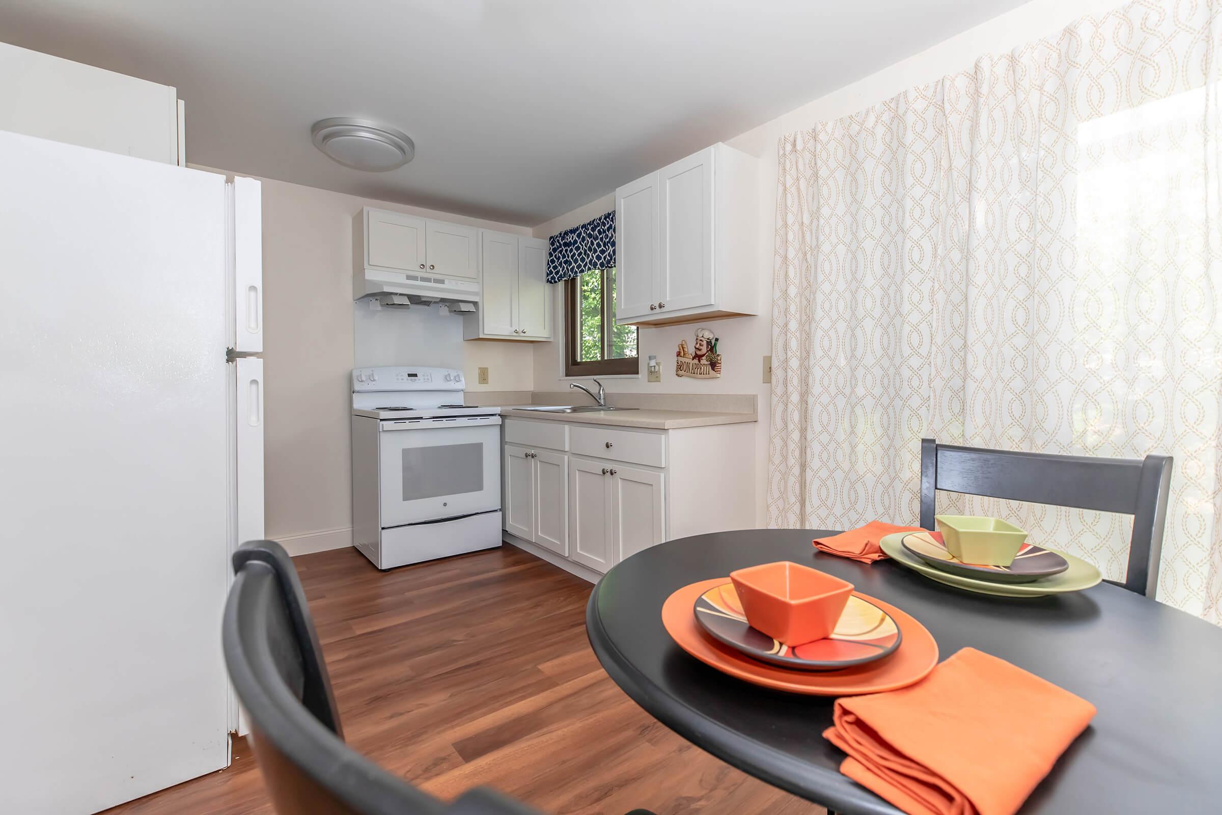 a kitchen with a table in a room