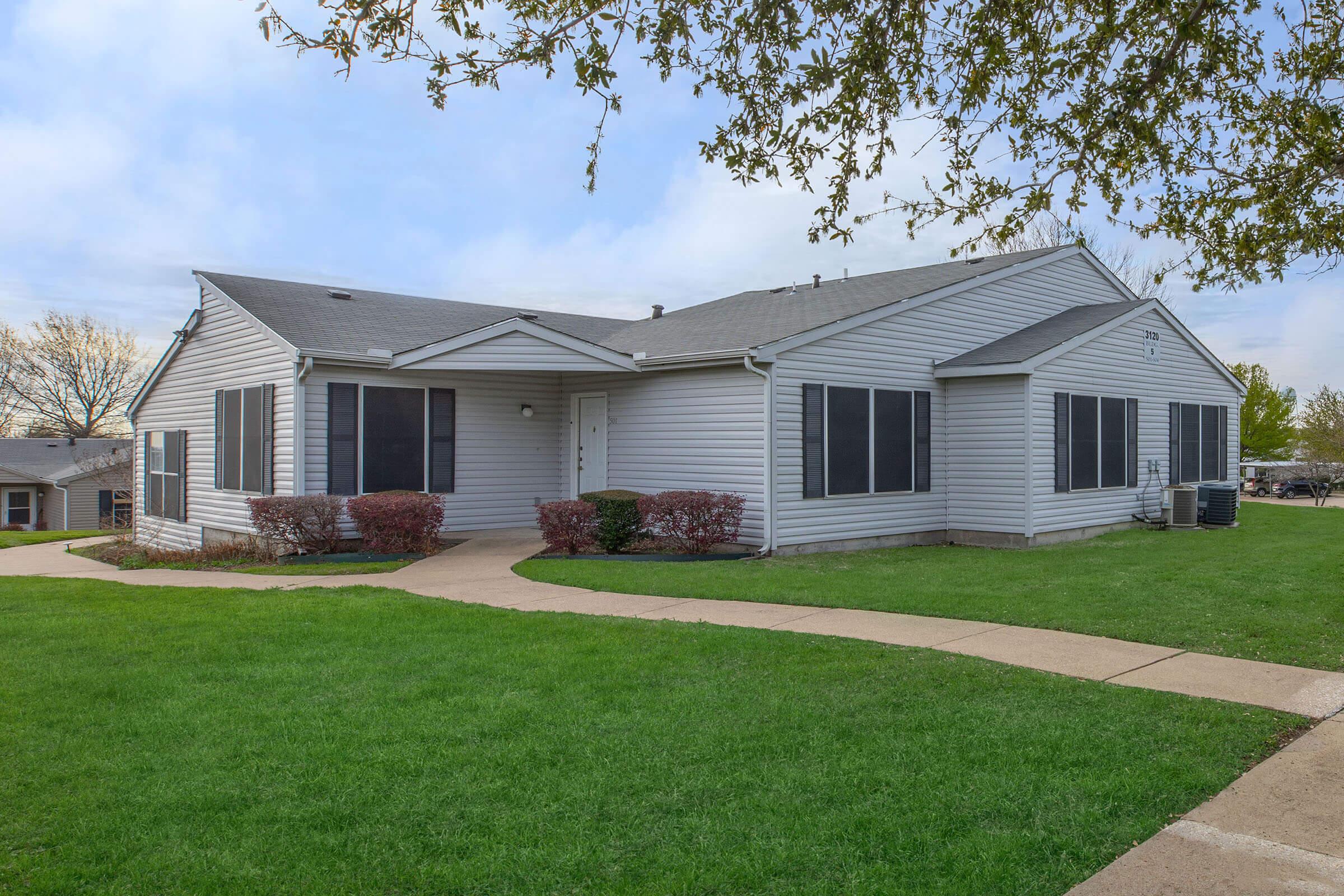 a large lawn in front of a house