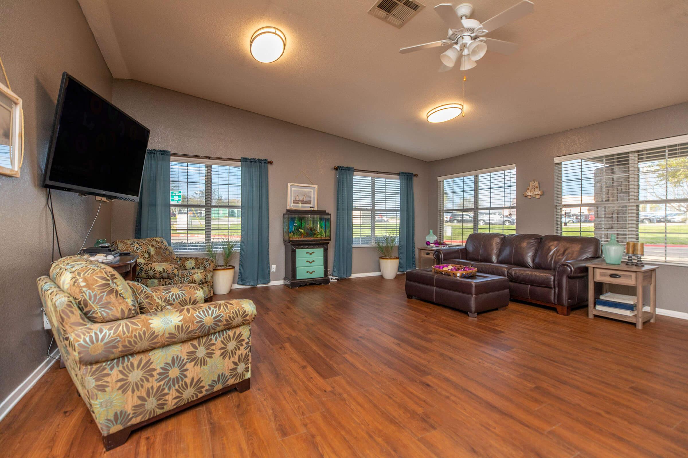 a living room filled with furniture and a fireplace