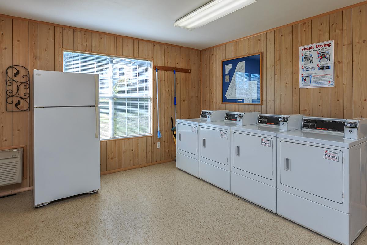 a white refrigerator freezer sitting inside of a kitchen