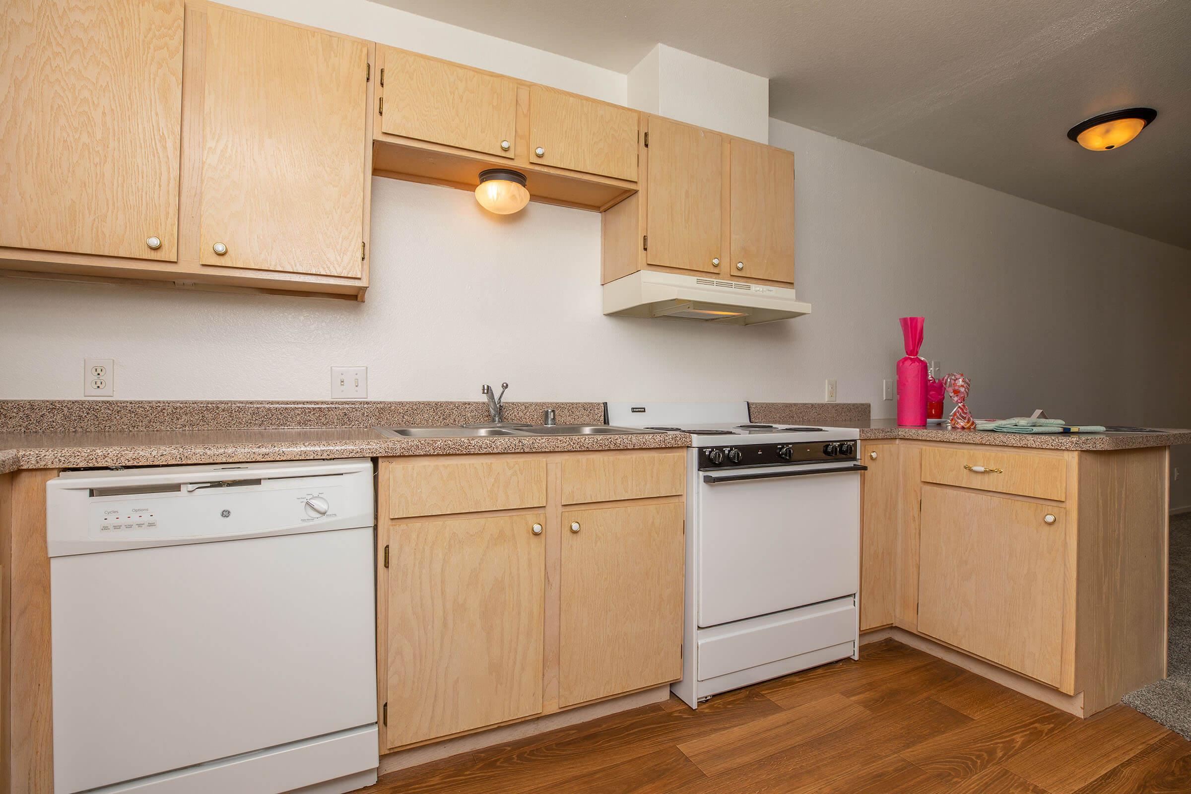 a kitchen with a stove and a refrigerator