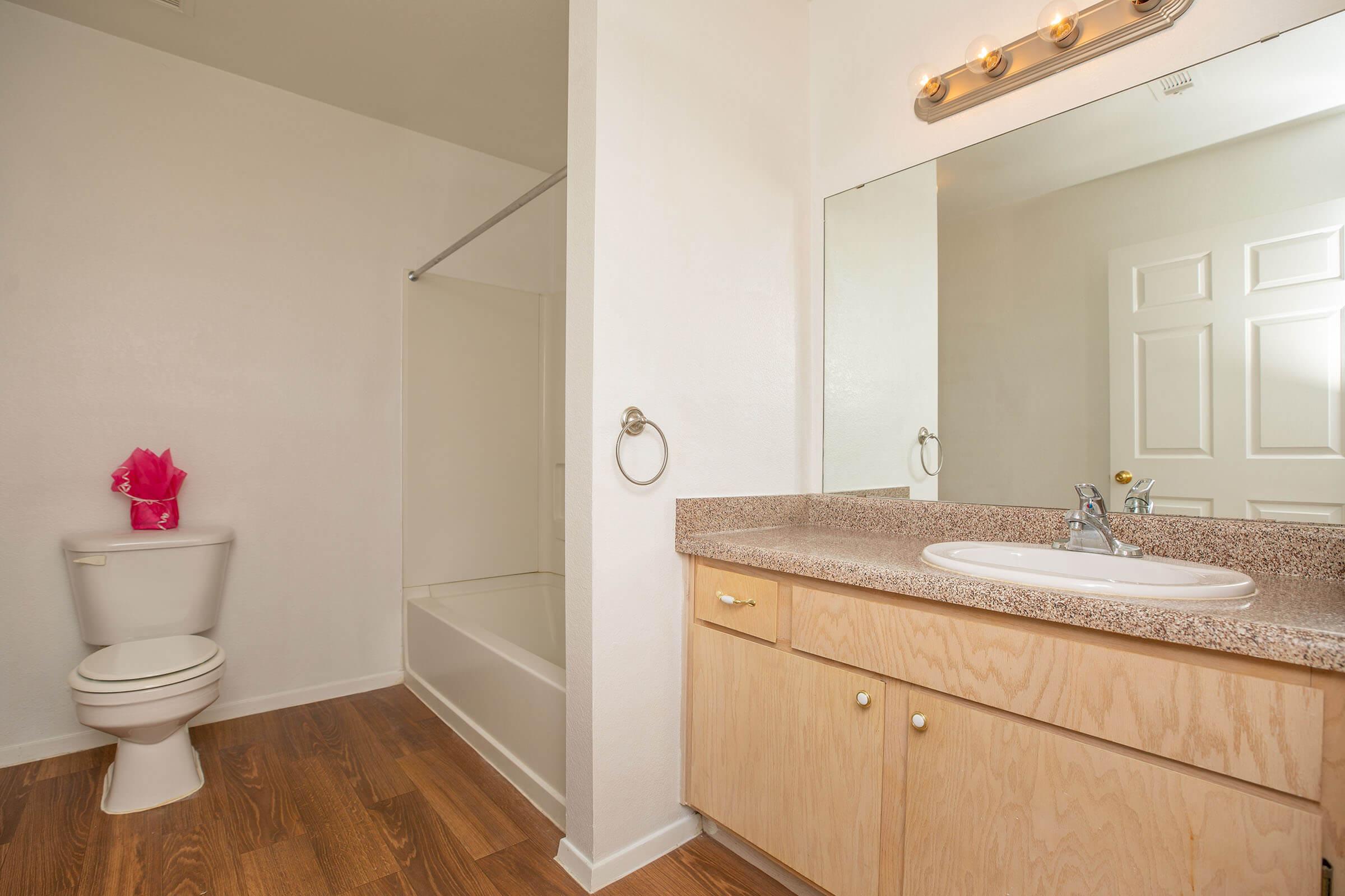 a kitchen with a sink and a mirror