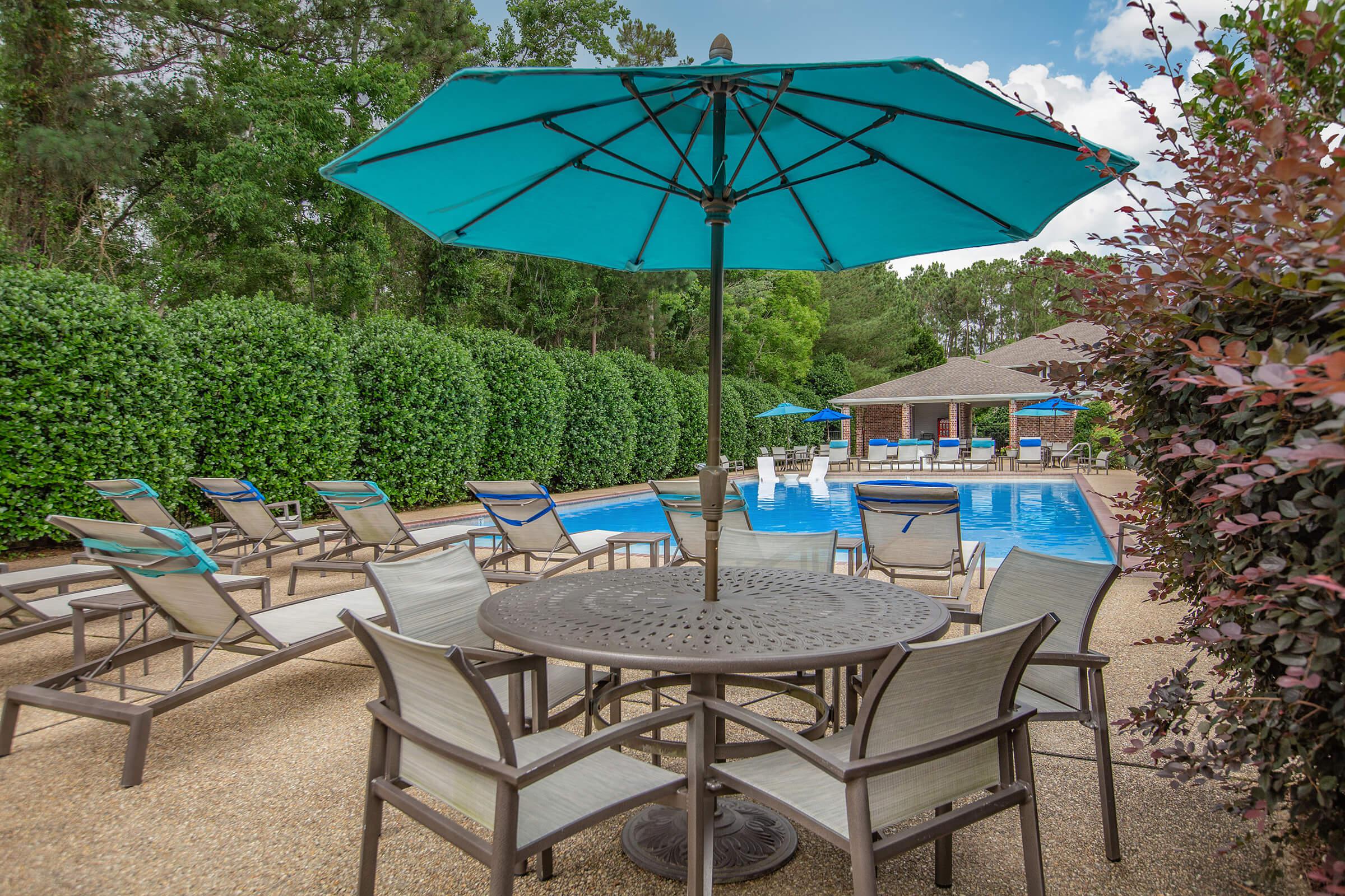 a table topped with a blue umbrella