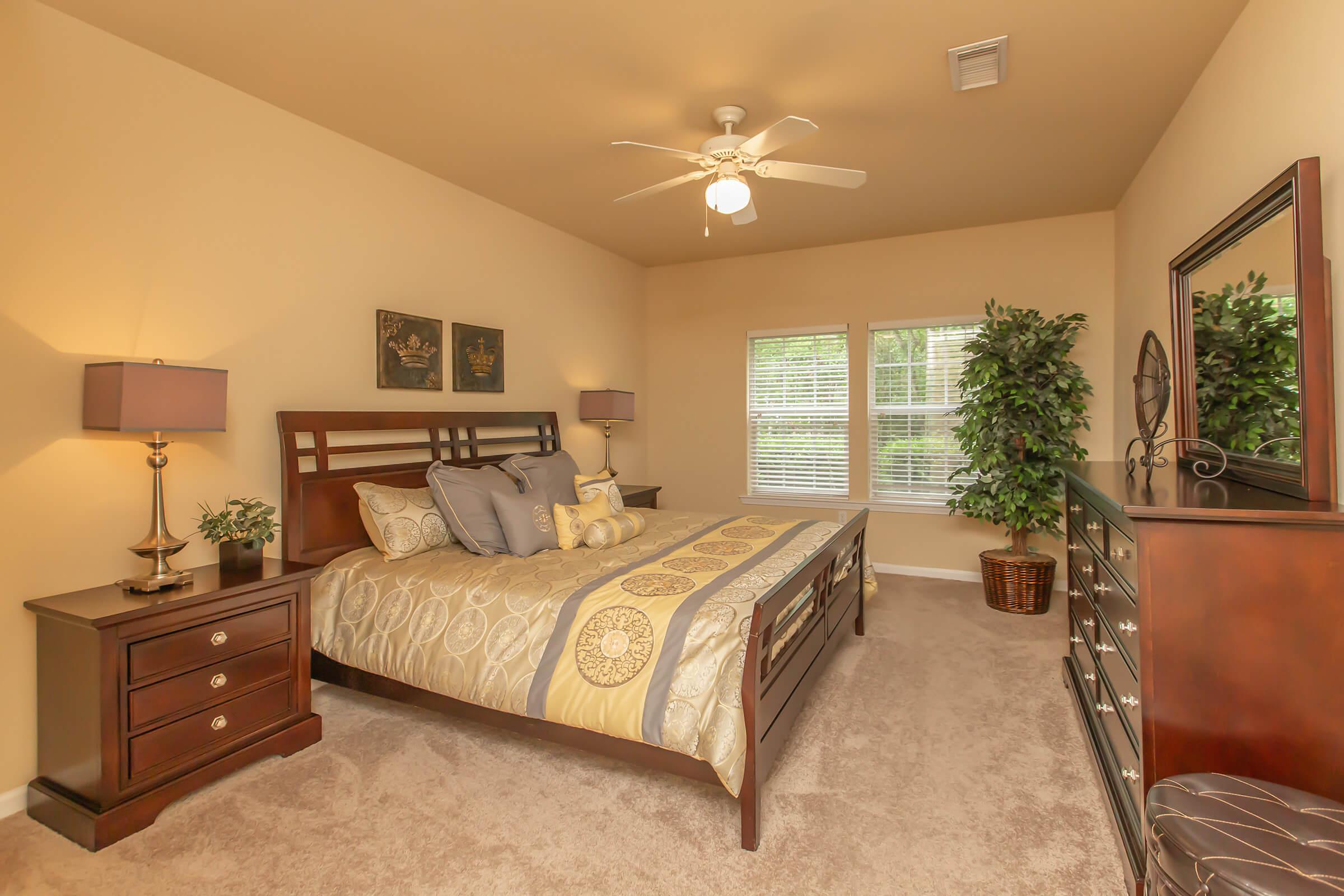 a bedroom with a bed and a couch in a living room