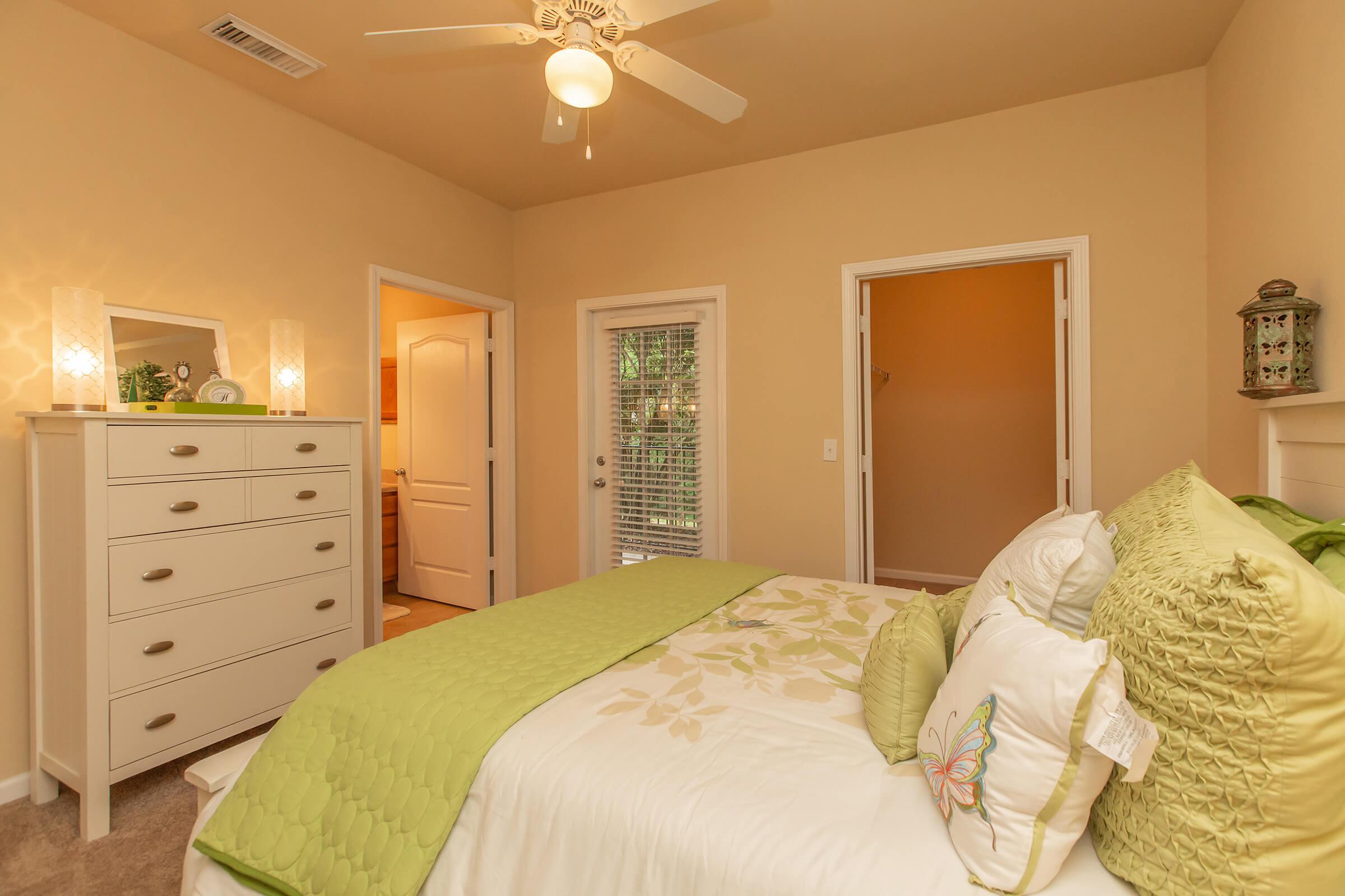 a bedroom with a bed in a hotel room