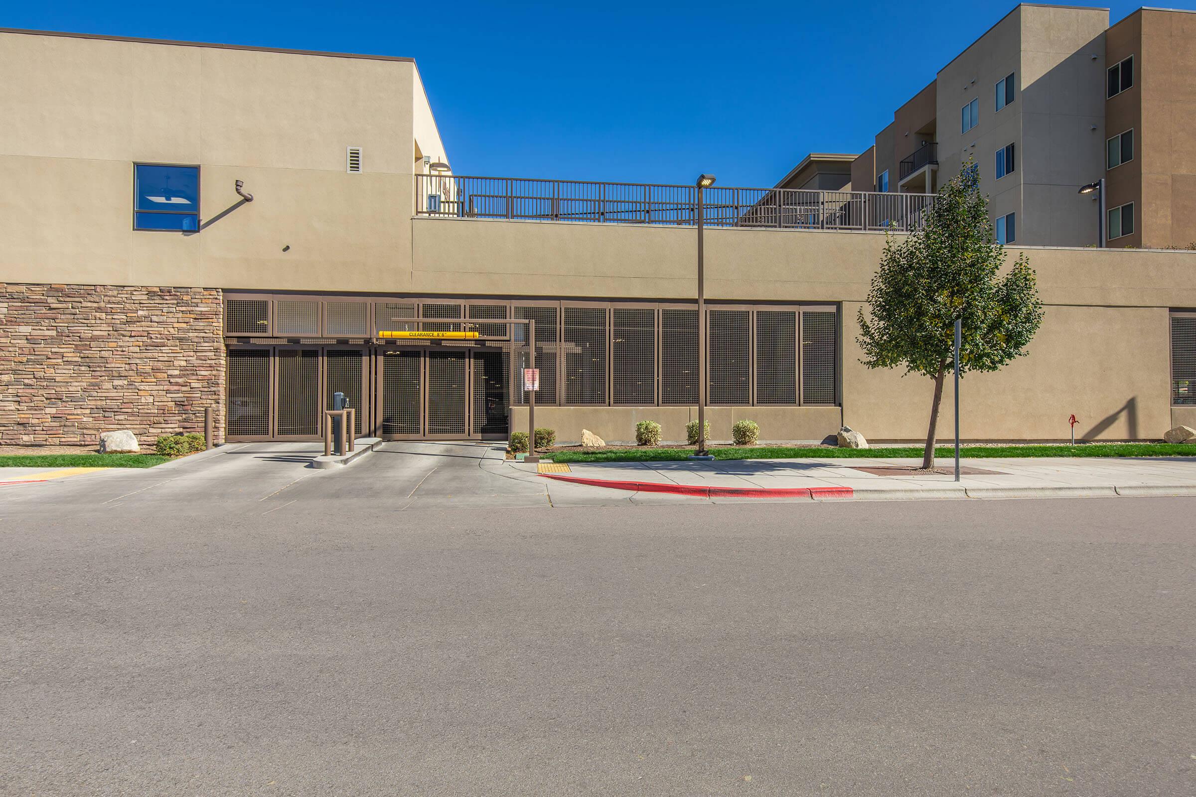 an empty parking lot in front of a building