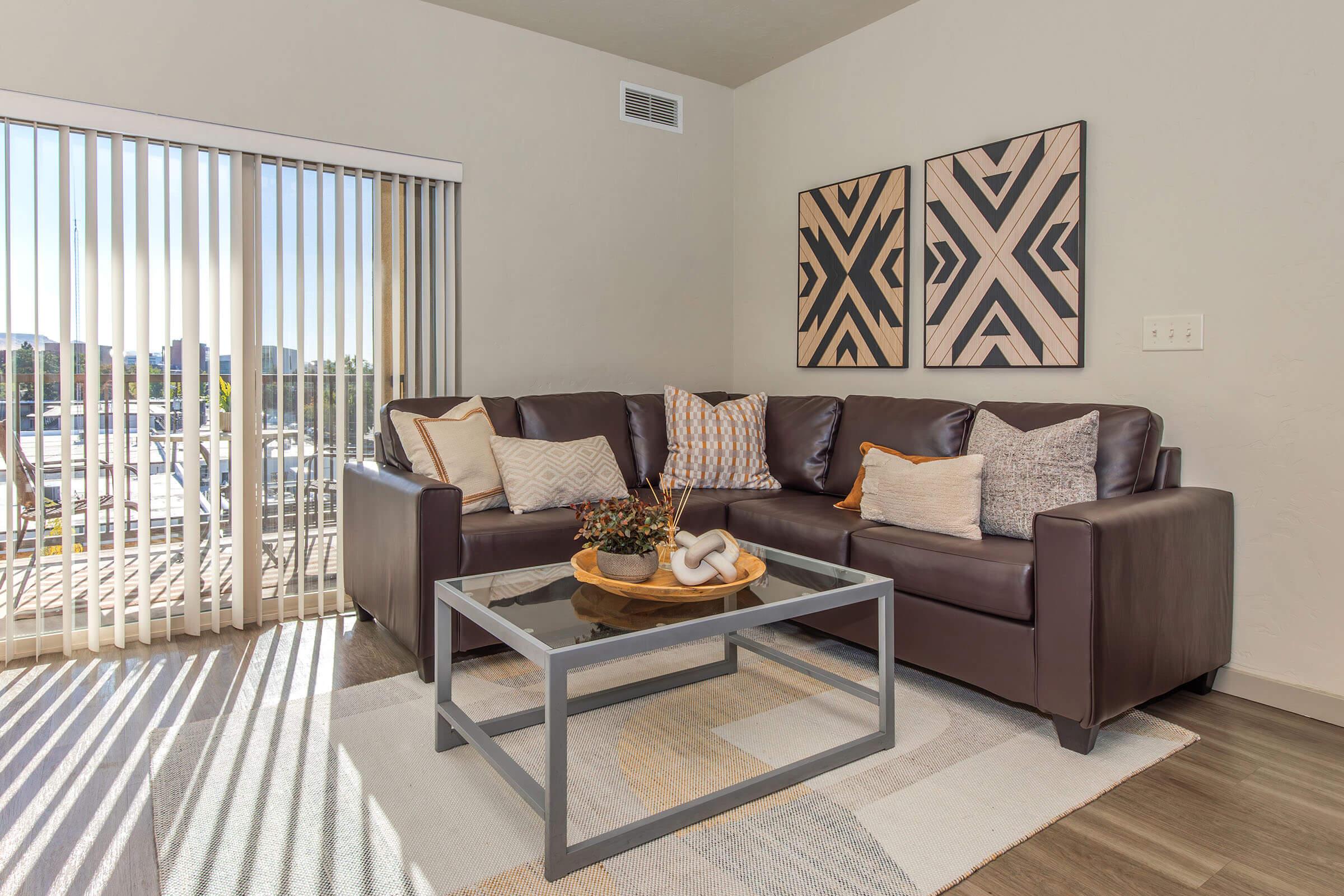 a living room filled with furniture and a table