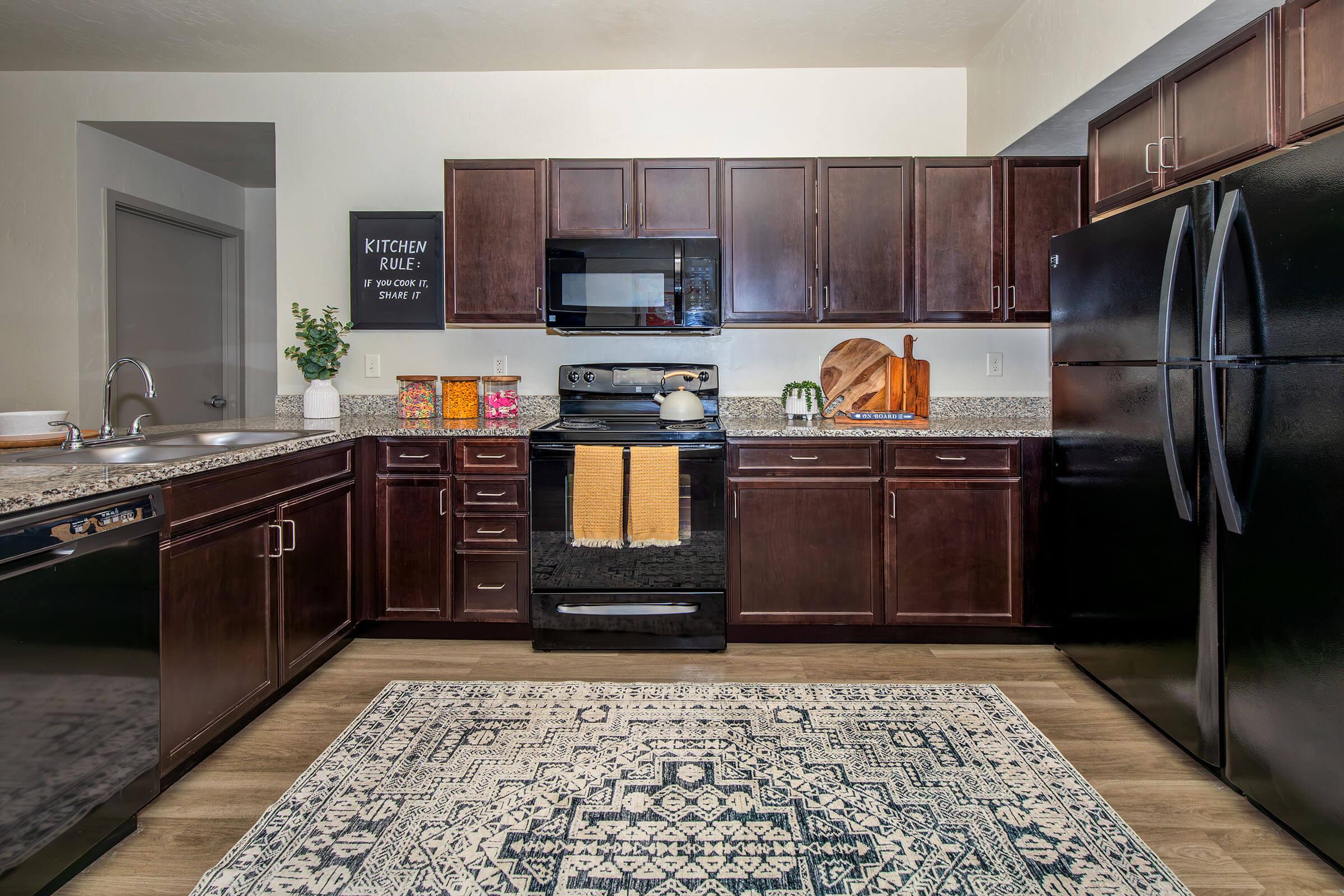 a modern kitchen with stainless steel appliances