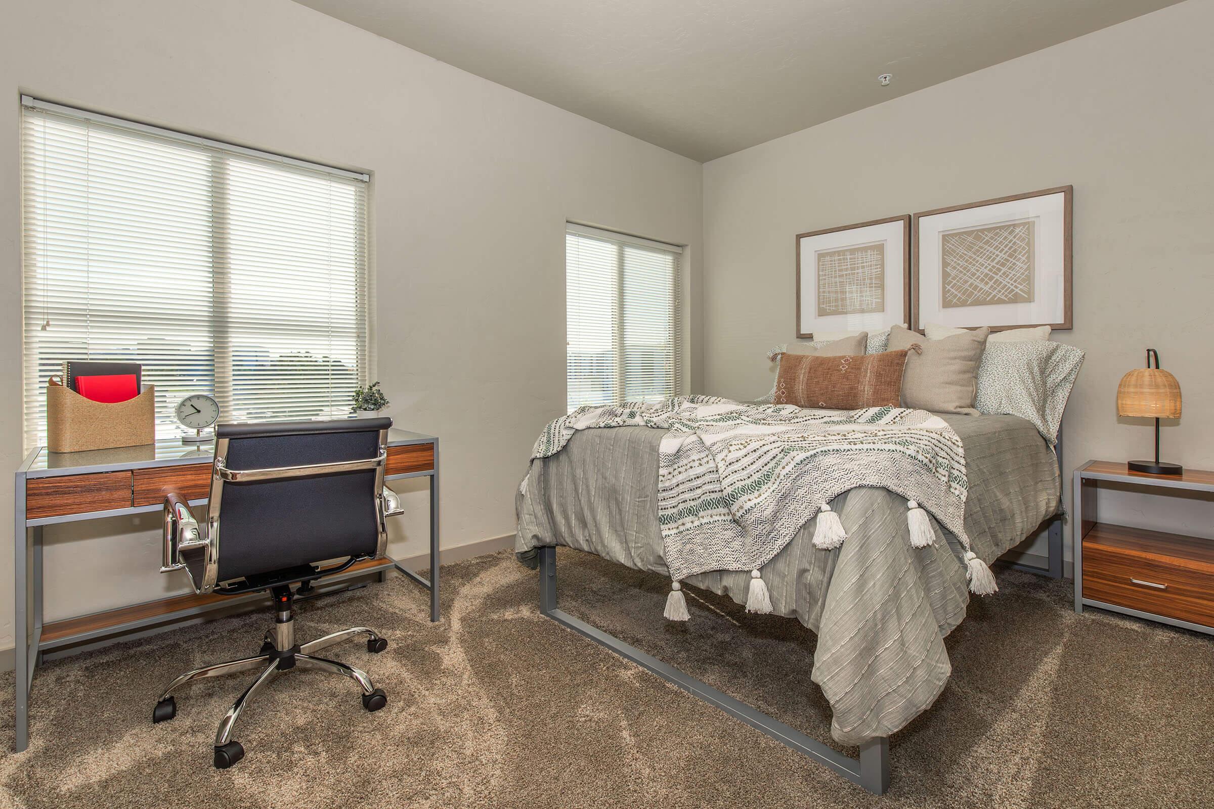 a living room filled with furniture and a large window