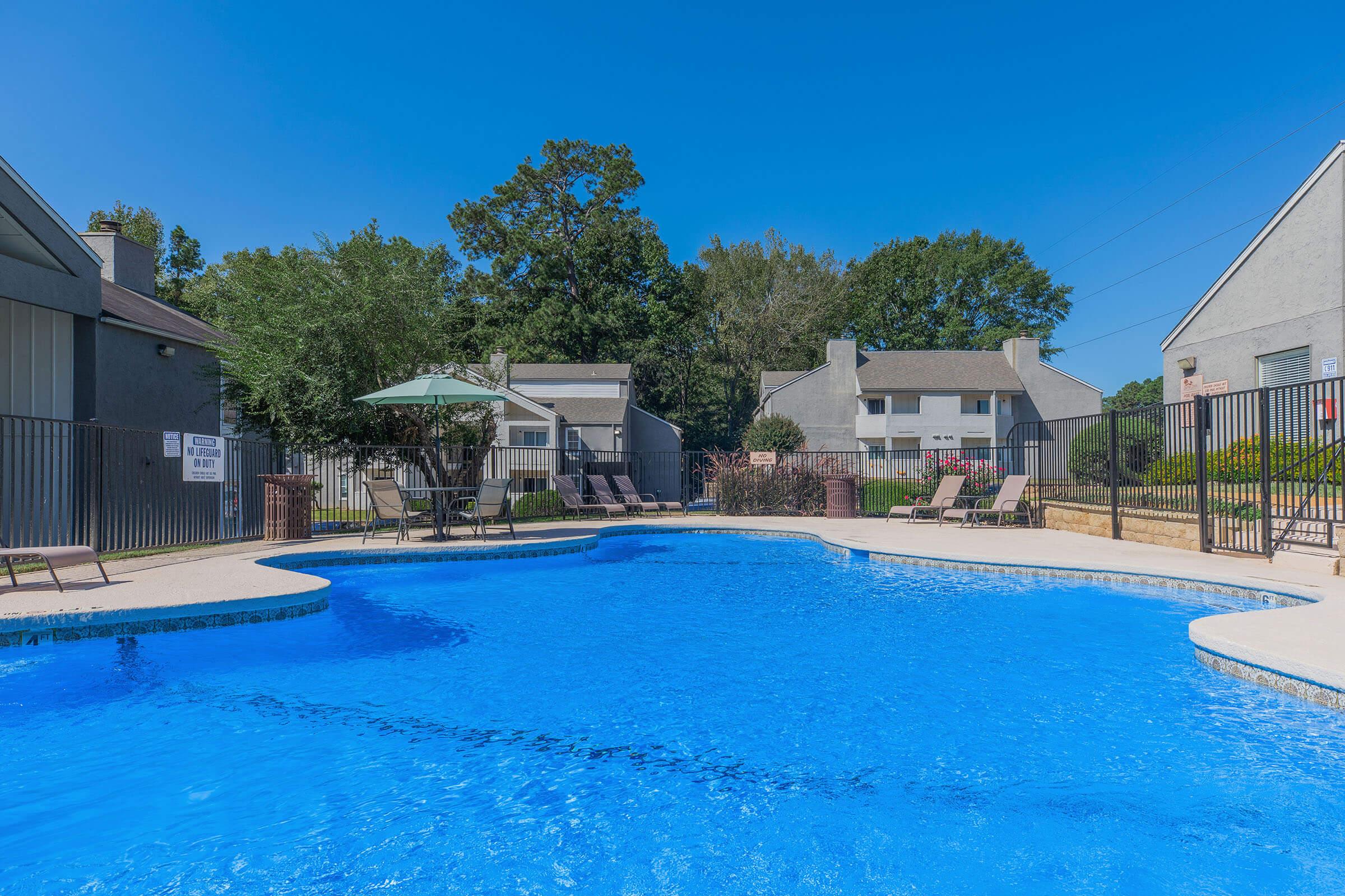 a house with a large pool of water