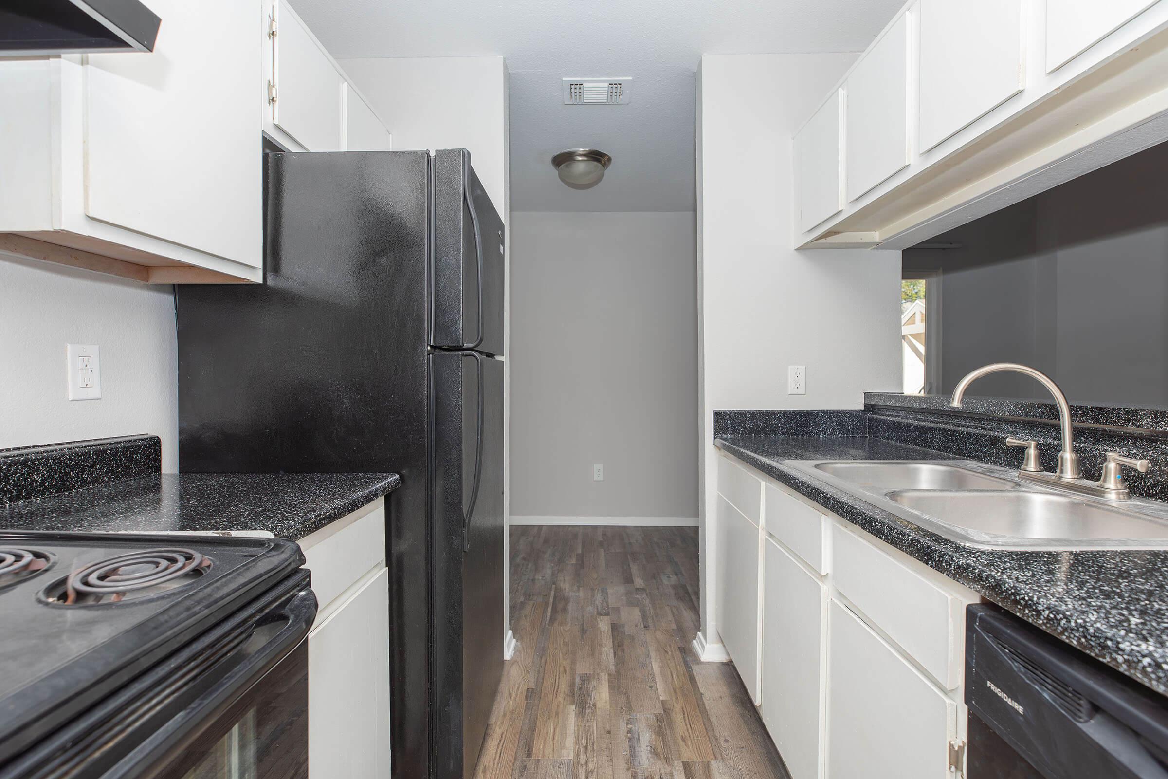 a kitchen with a stove top oven