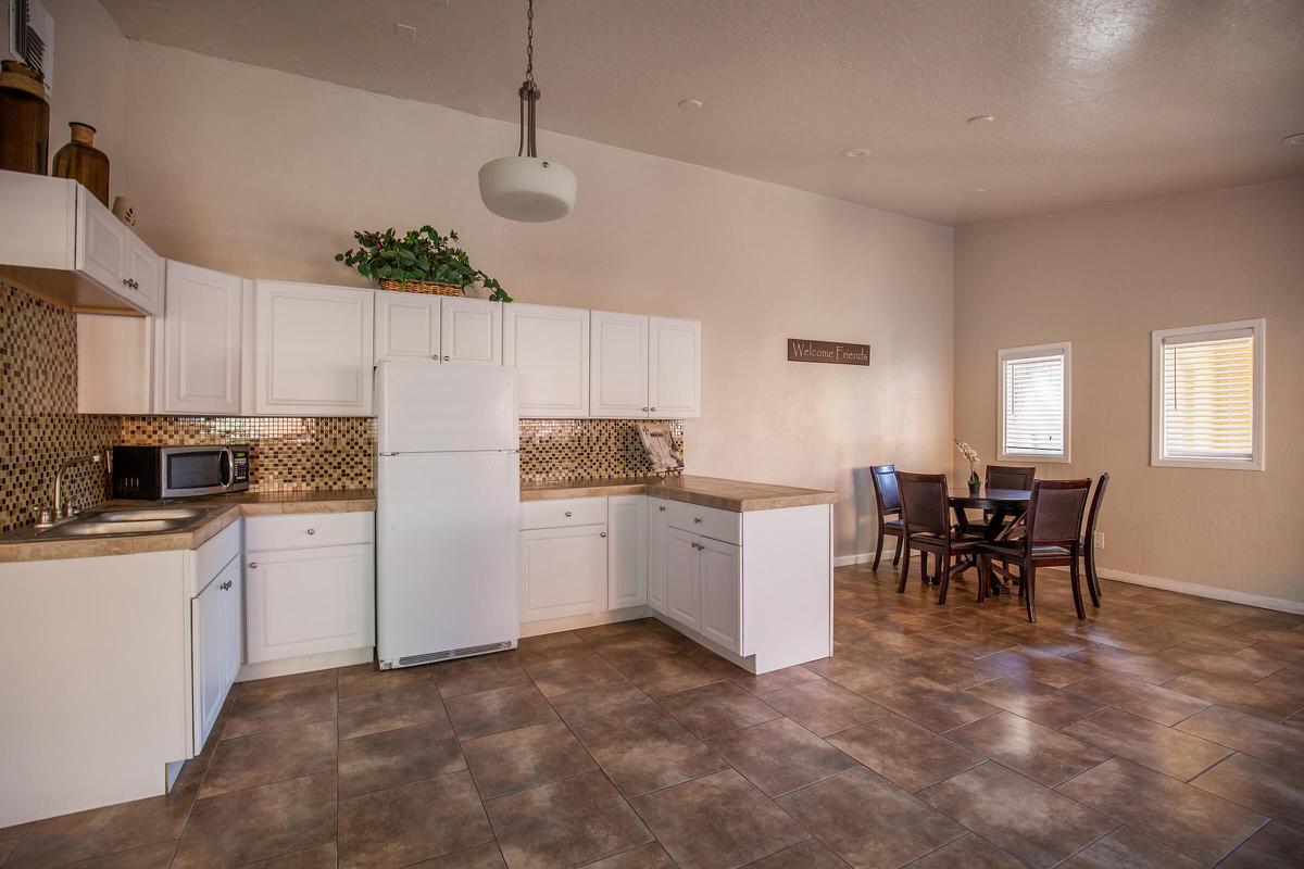 a kitchen filled with lots of furniture