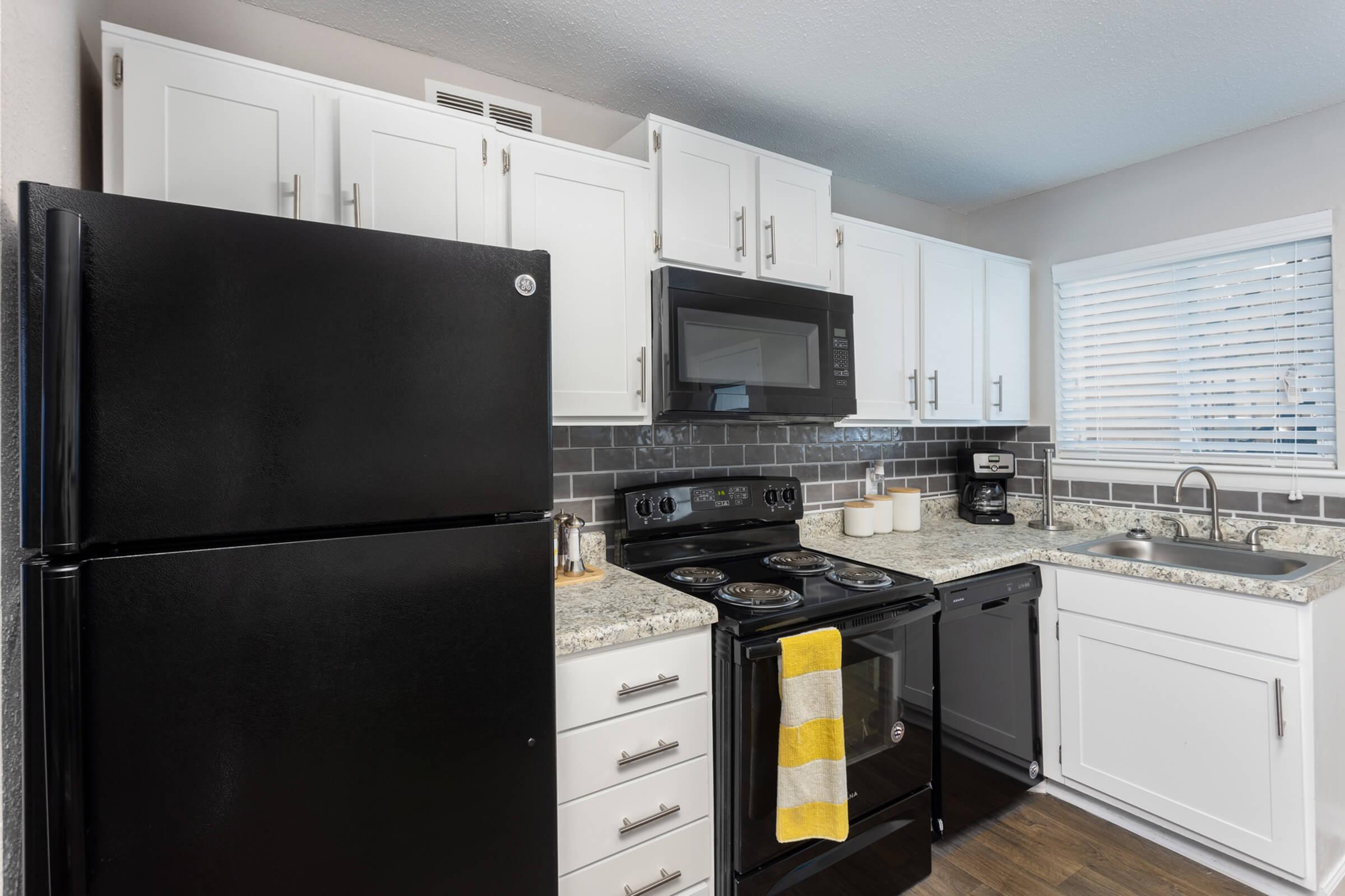 a kitchen with a stove top oven sitting inside of a refrigerator