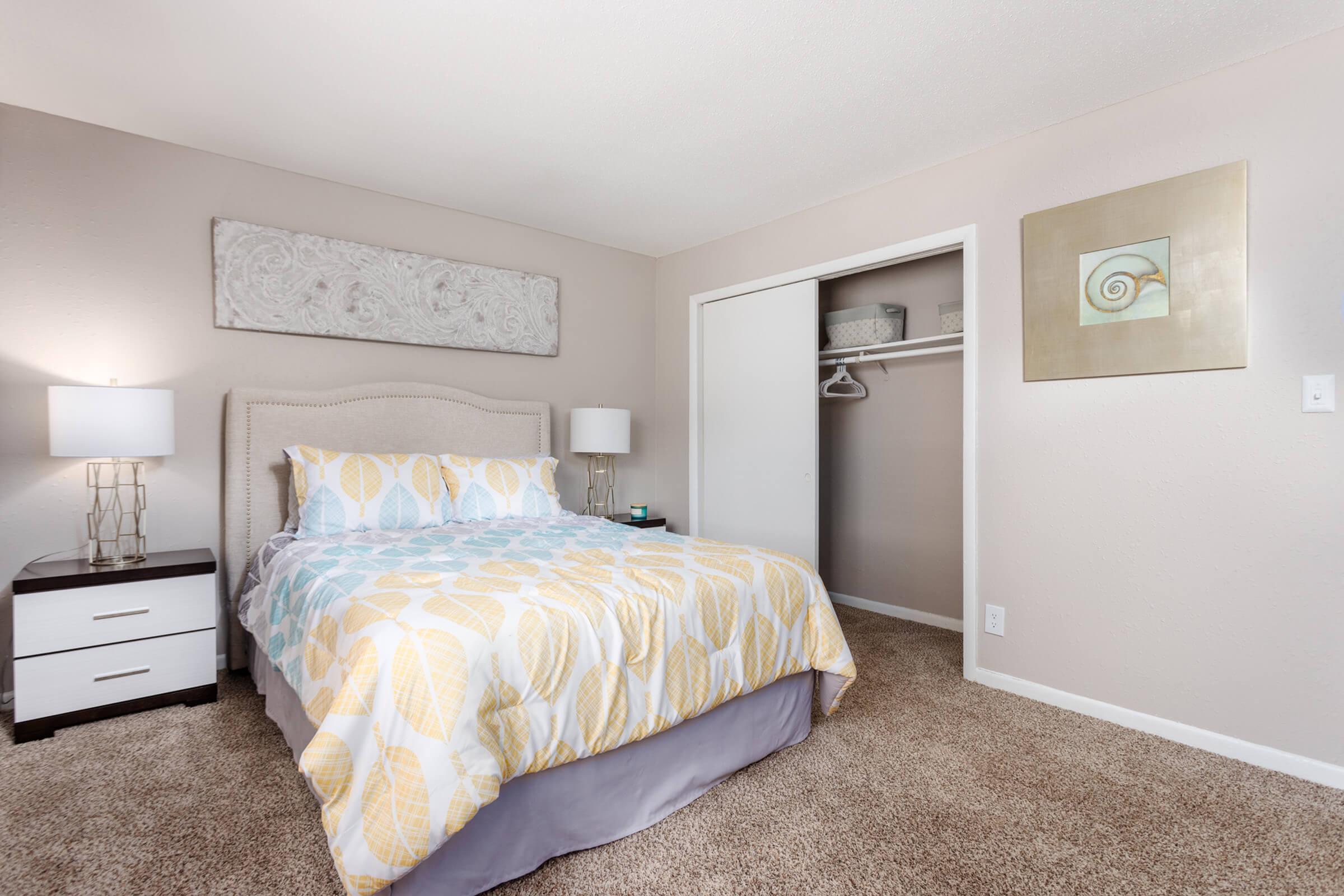 a bedroom with a bed in a room