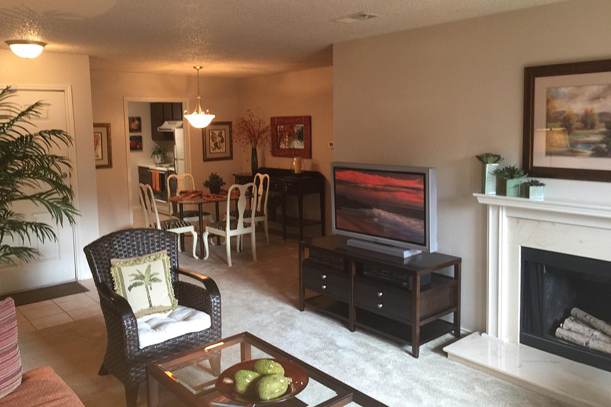 a living room filled with furniture and a fire place
