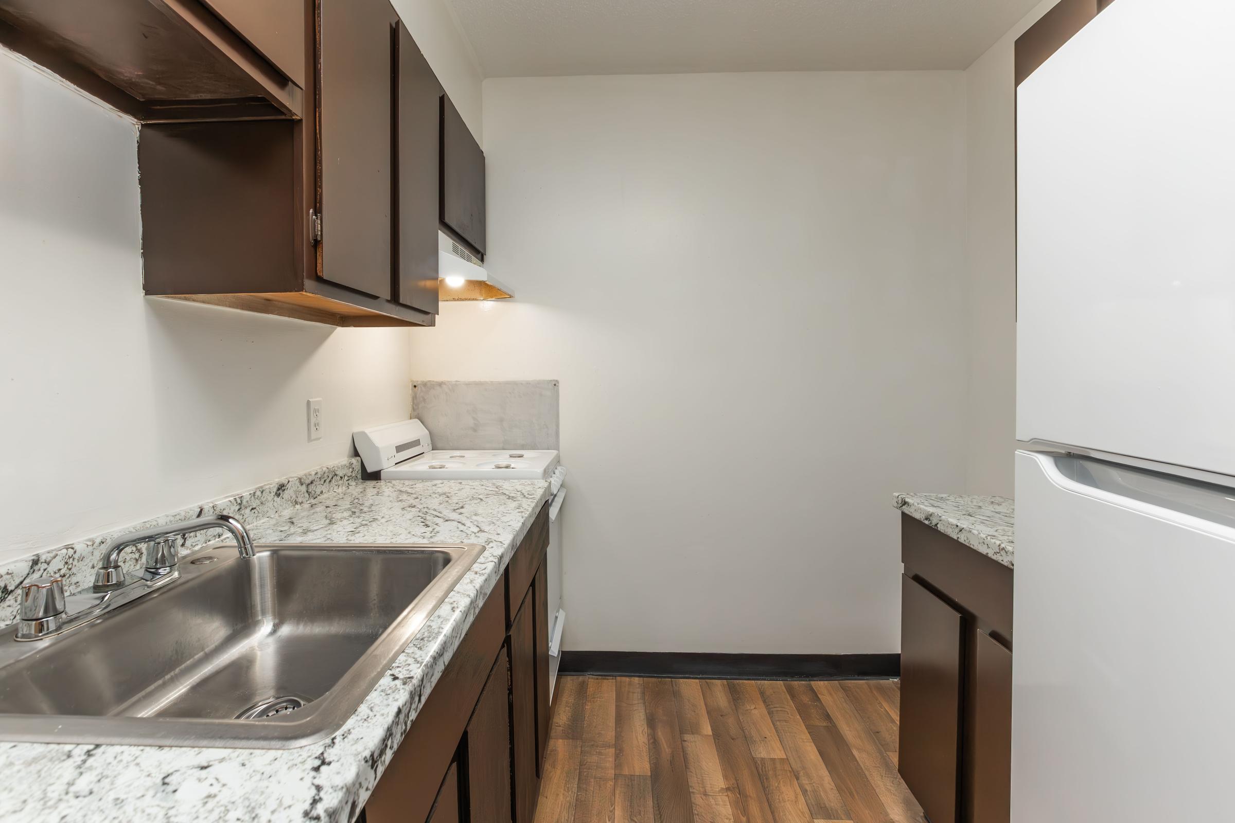 a kitchen with a stove and a sink