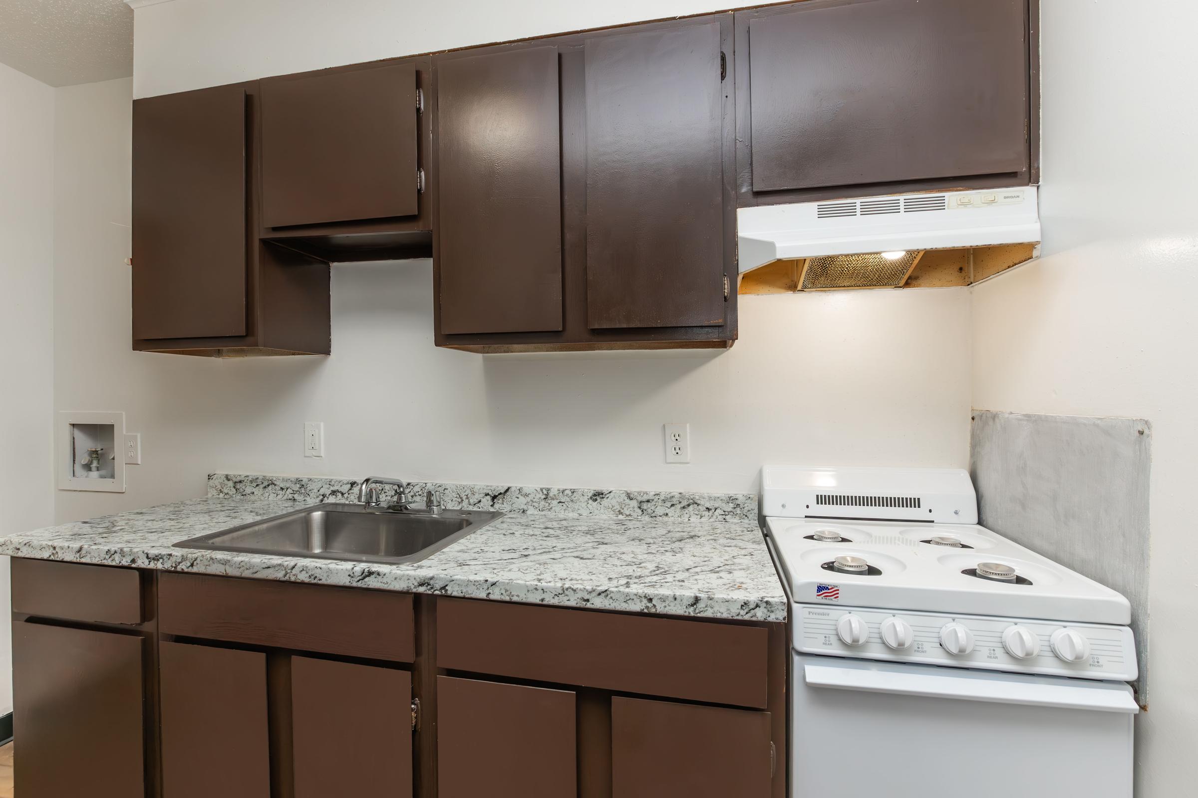 a kitchen with a sink and a microwave