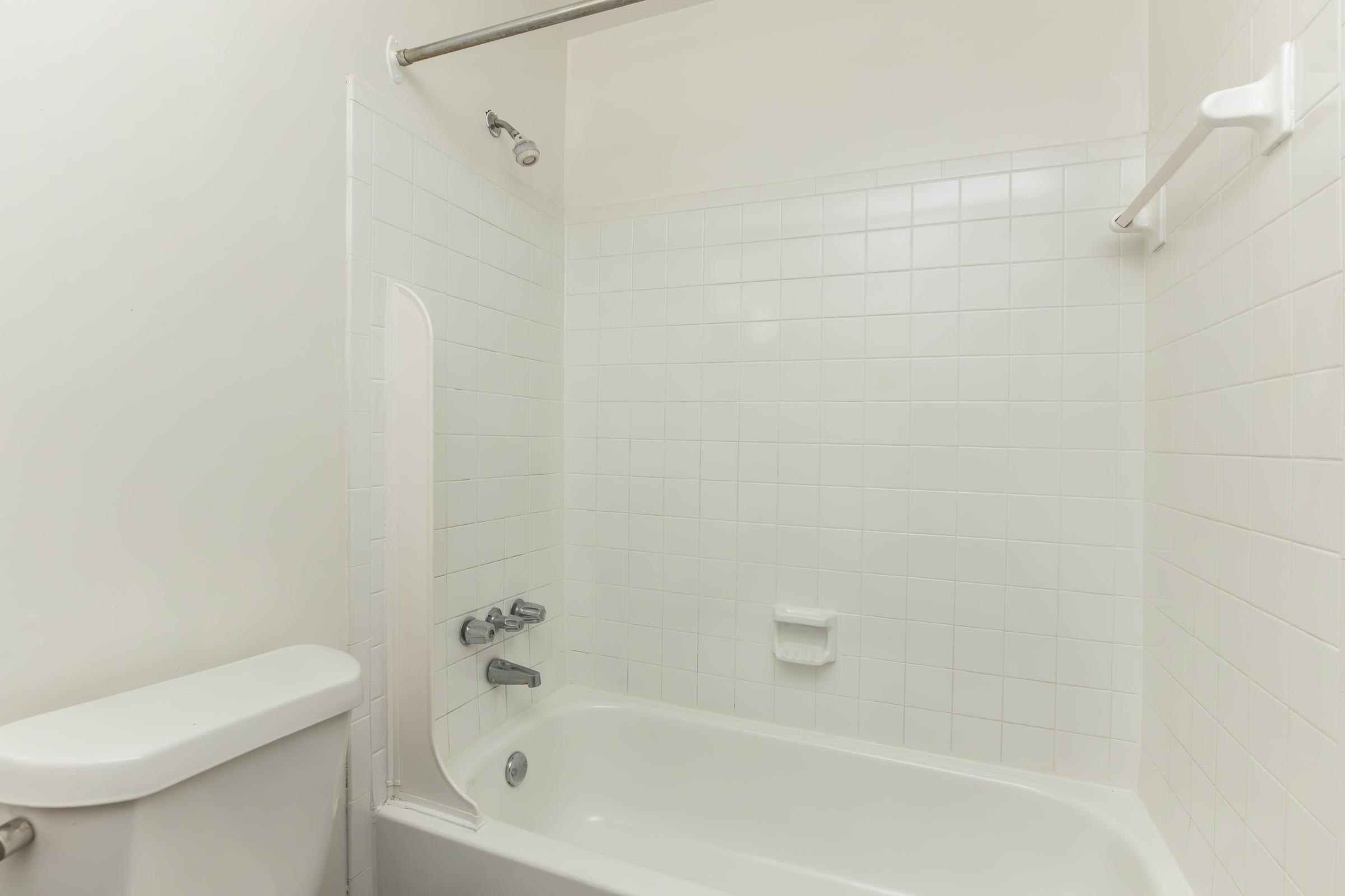 a close up of a sink and a bath tub