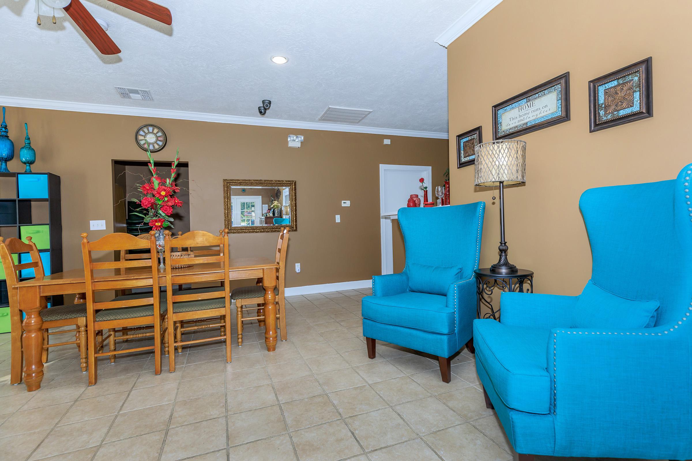 a living room with a blue chair