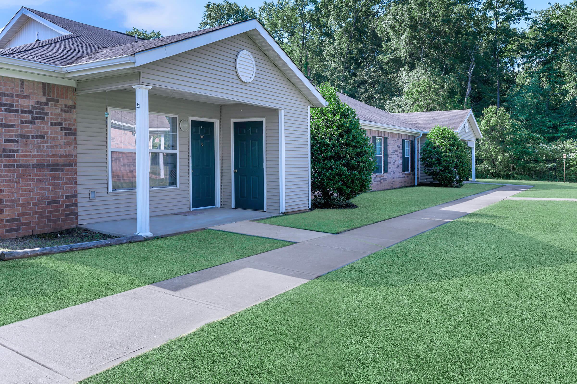 a large lawn in front of a house