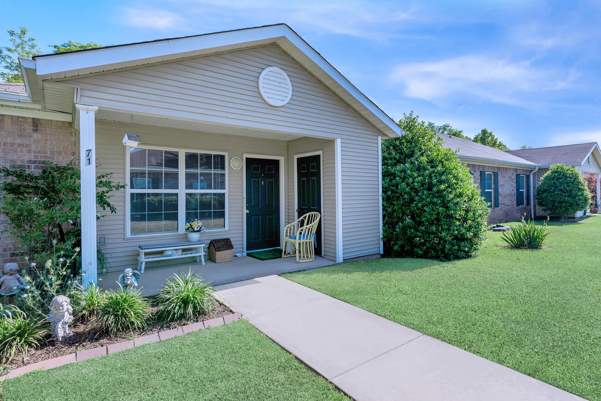 a large lawn in front of a house