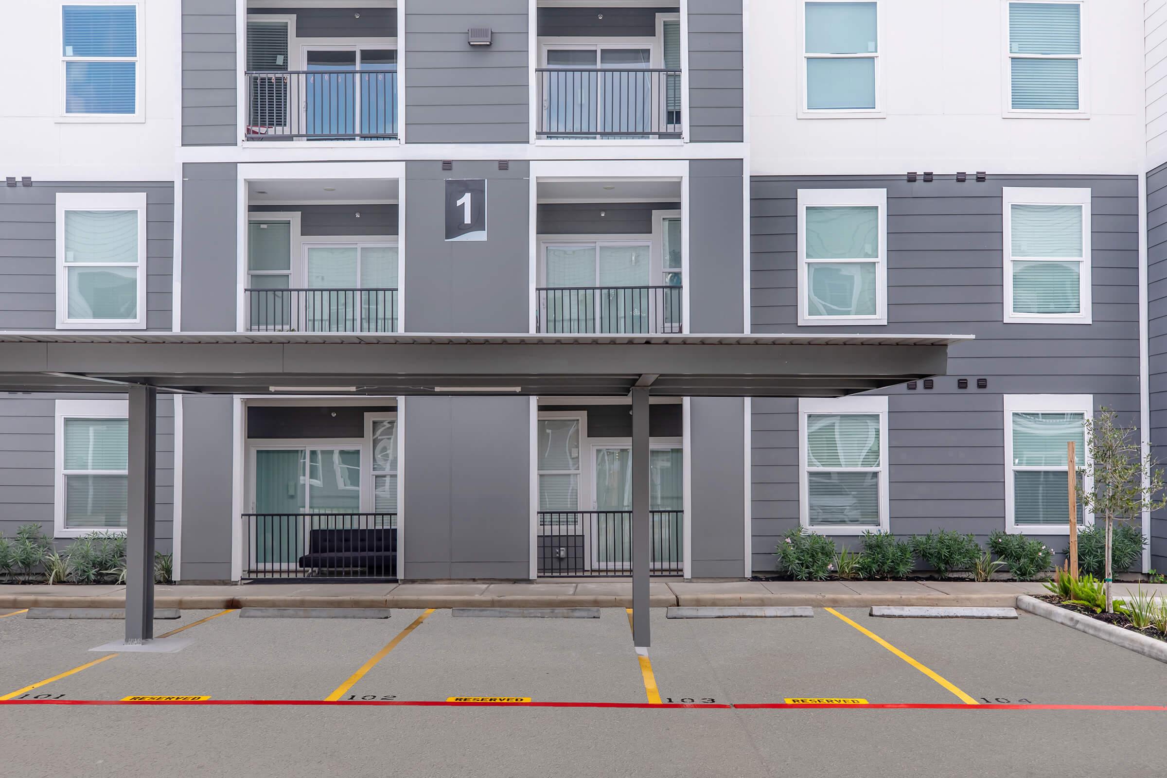 an empty parking lot in front of a building