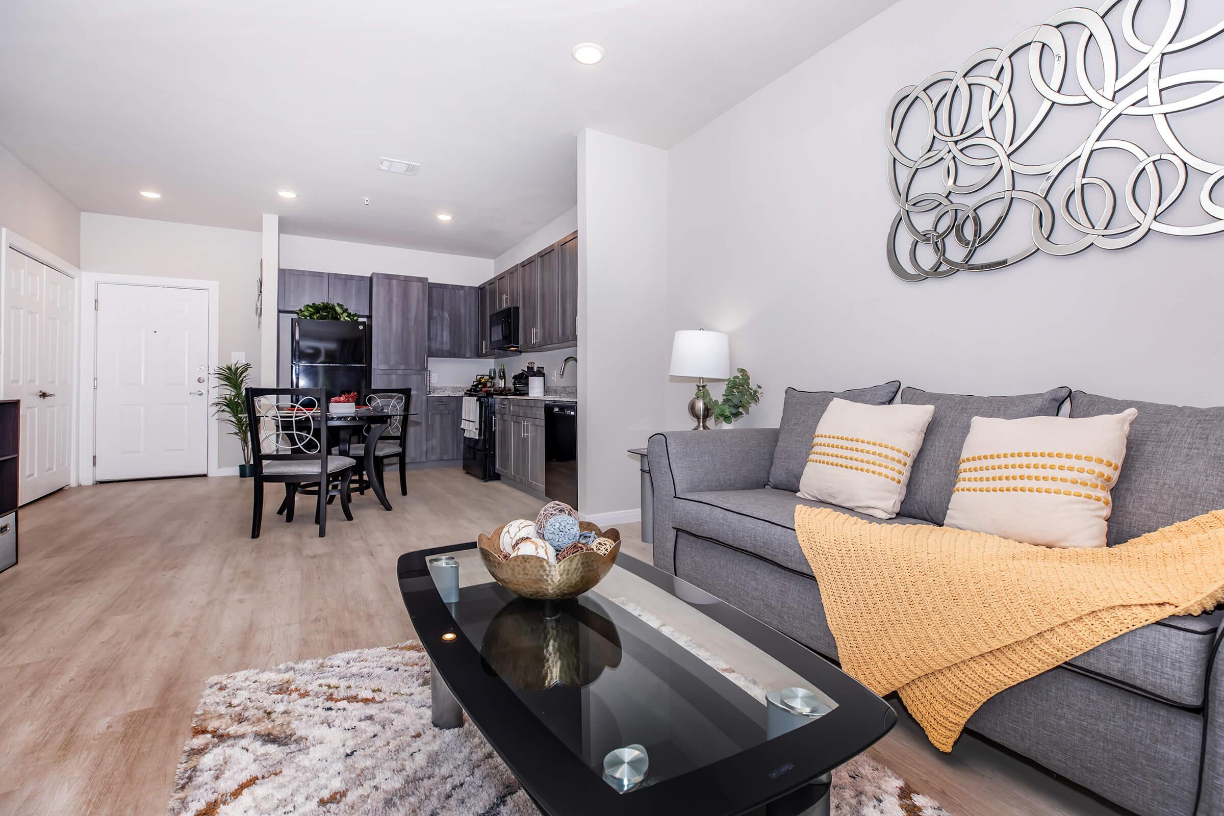 a living room filled with furniture and decor