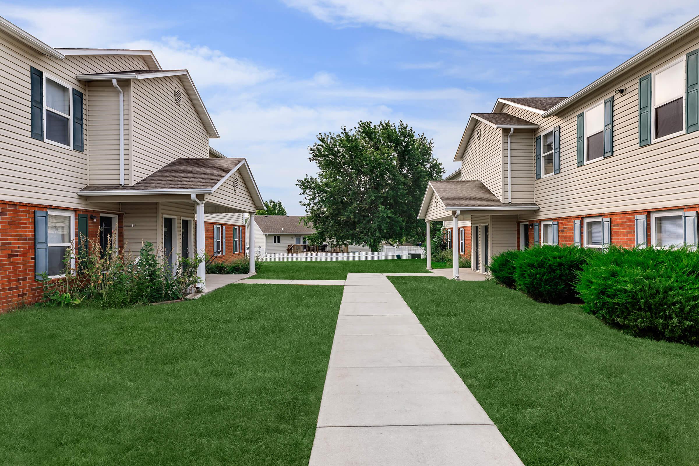 a large lawn in front of a house