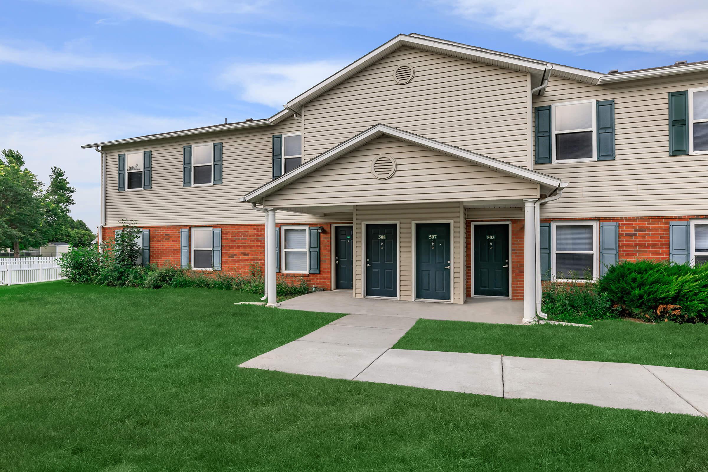 a large lawn in front of a house