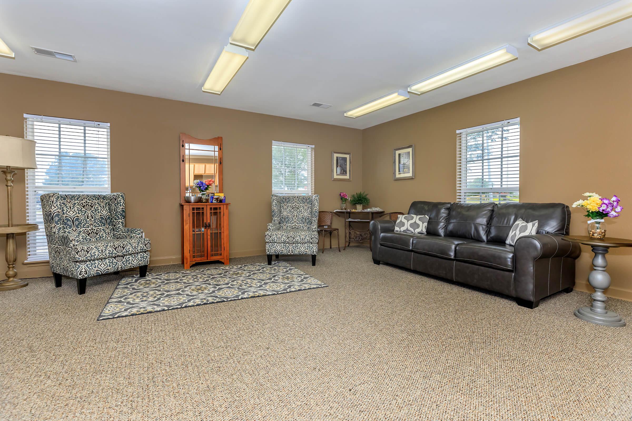 a living room filled with furniture and a flat screen tv