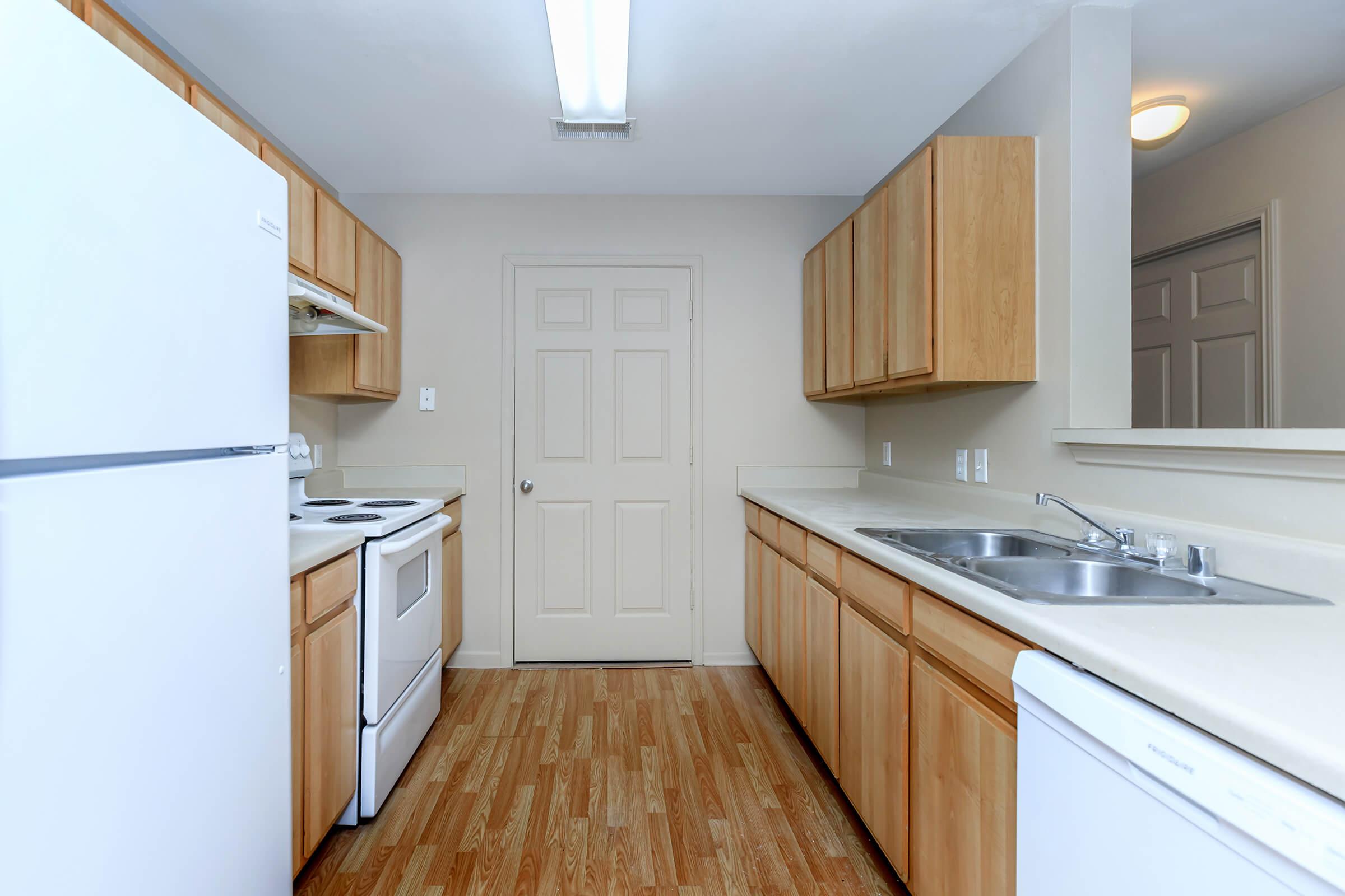 a kitchen with a stove and a refrigerator