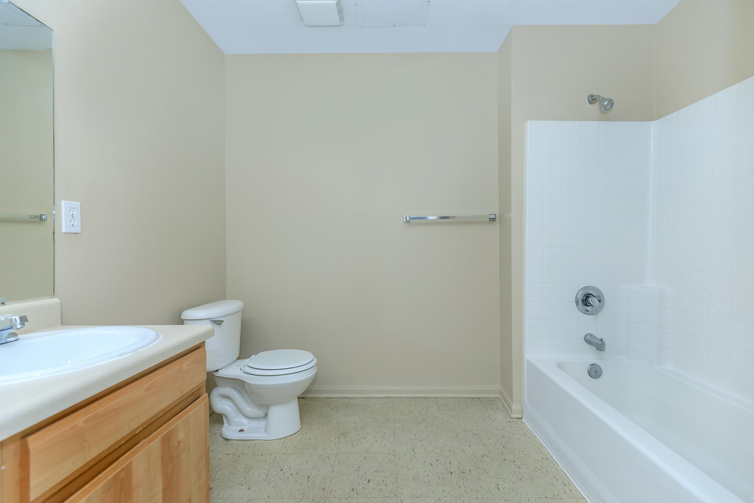 a room with a sink and a shower