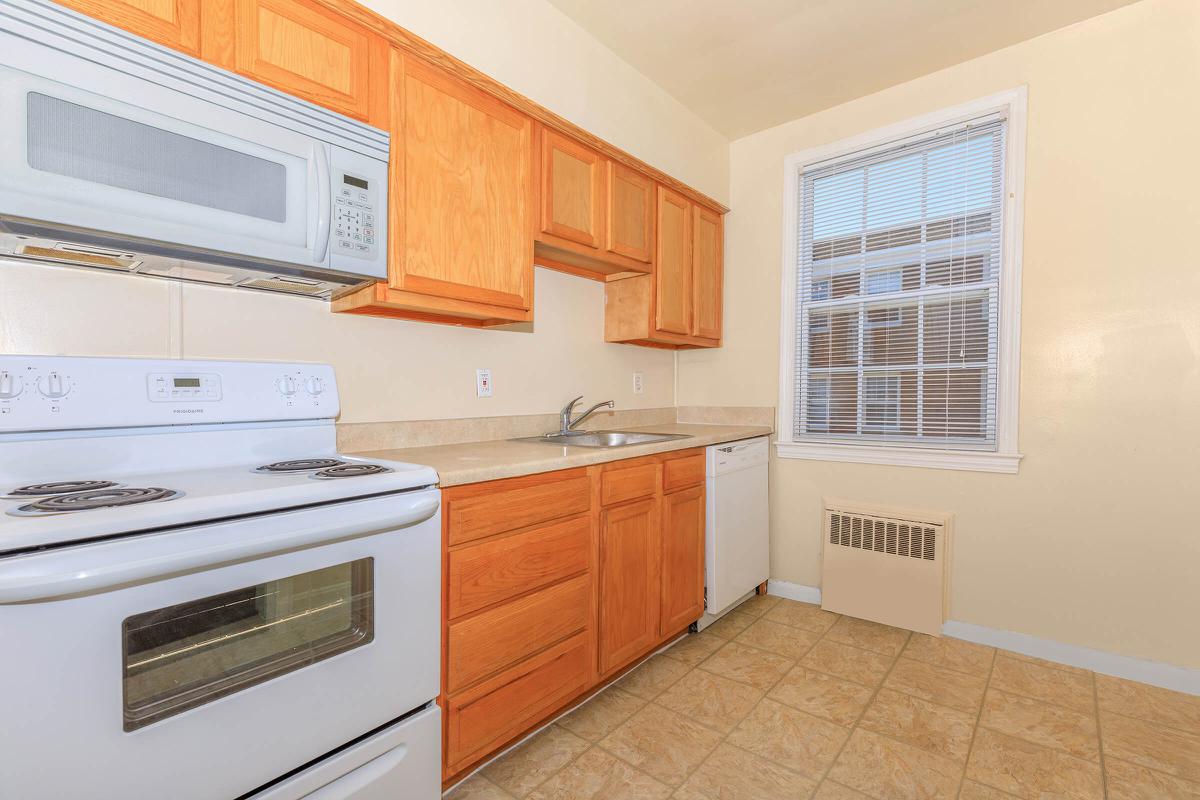 a kitchen with a stove top oven sitting inside of a microwave