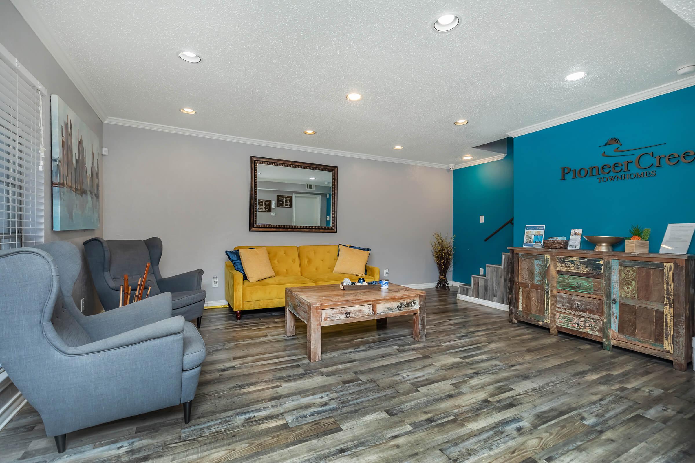 a living room filled with furniture and a tv