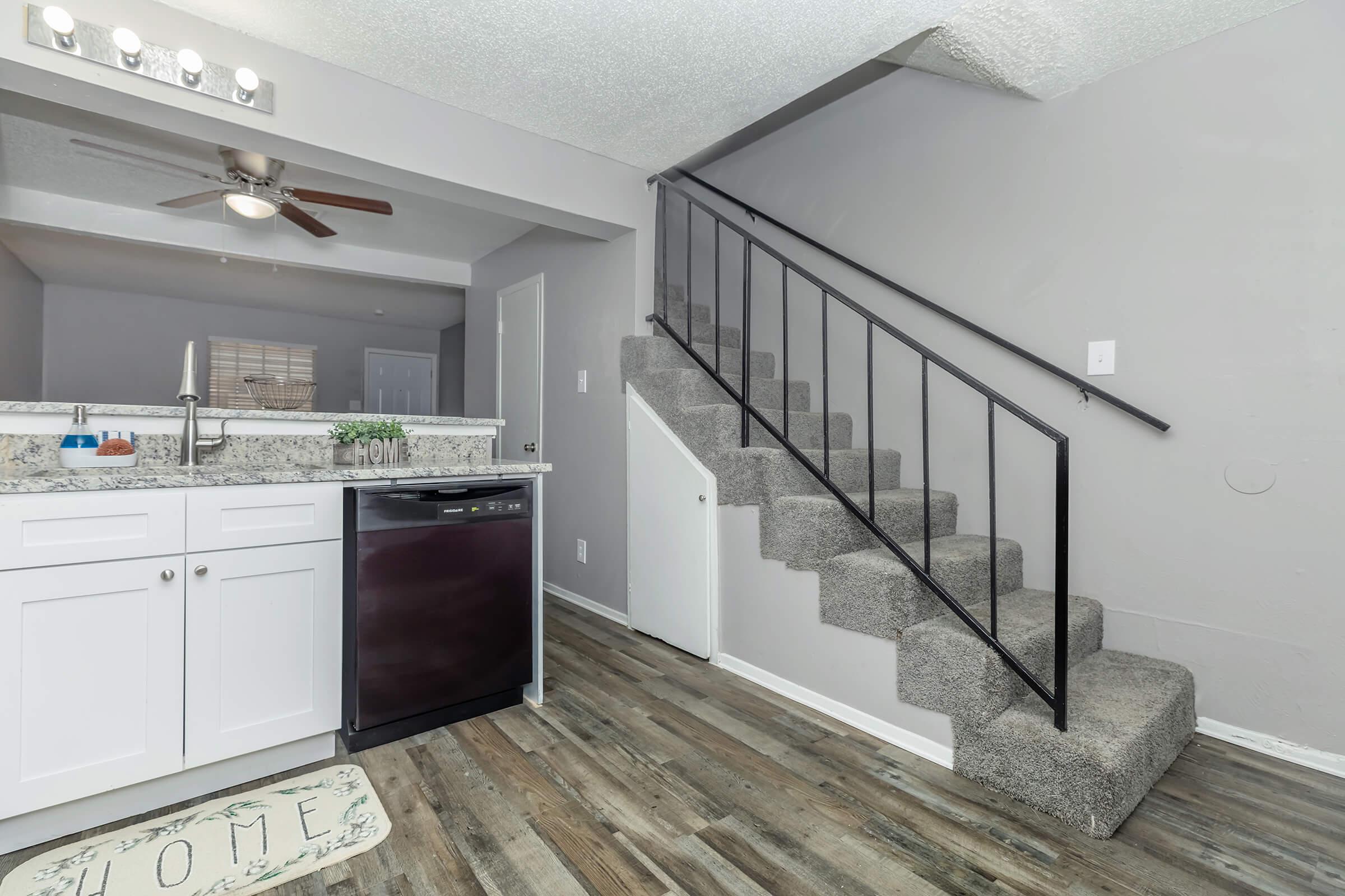 a kitchen with wooden cabinets