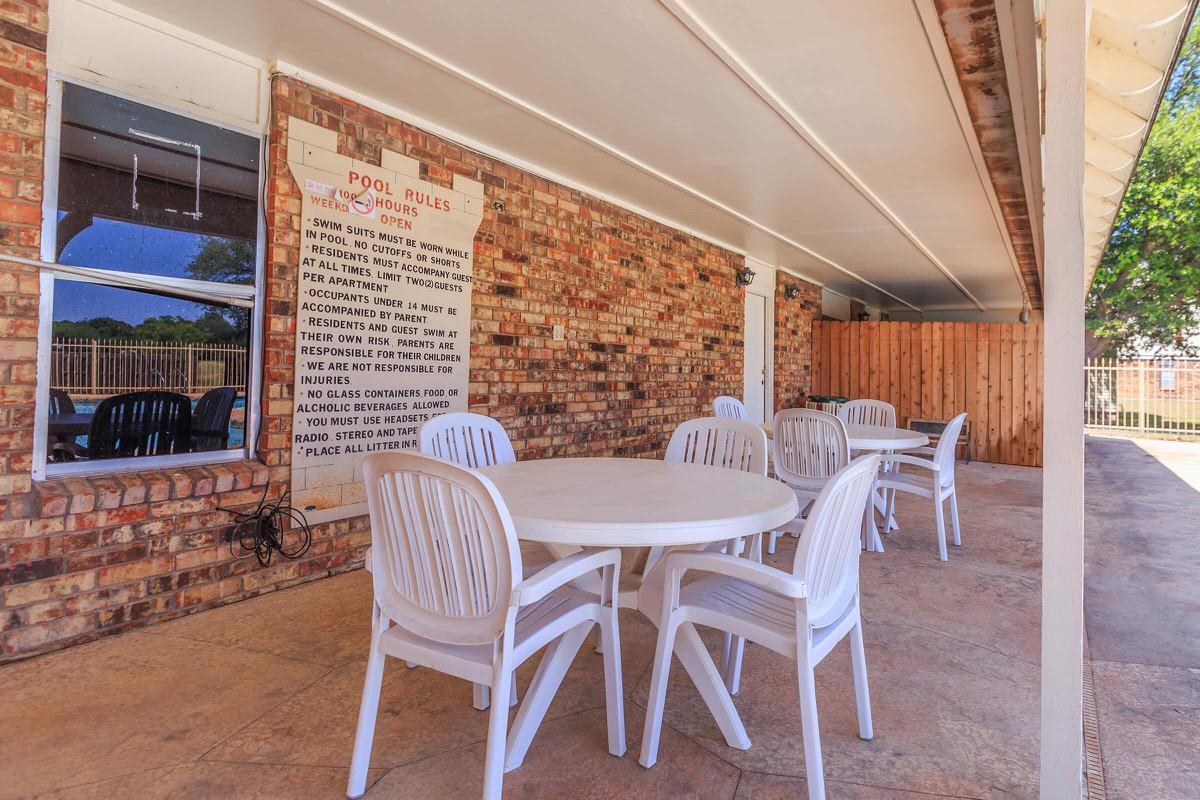 a dining room table in front of a building