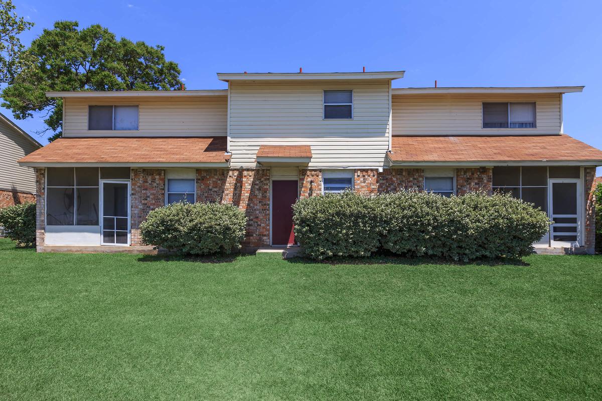 a large lawn in front of a house
