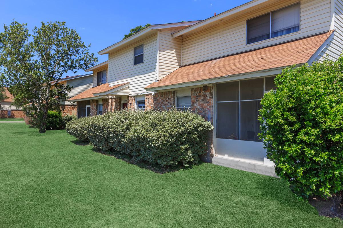 a large lawn in front of a house