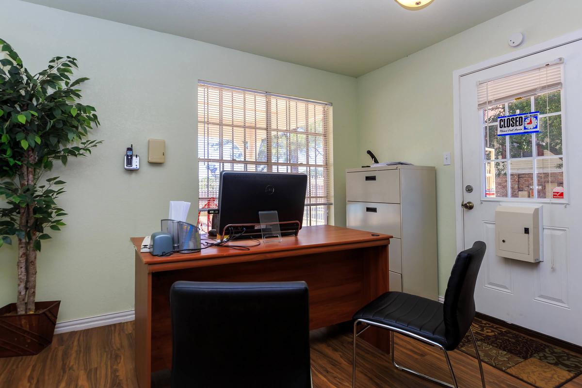 a room filled with furniture and a large window